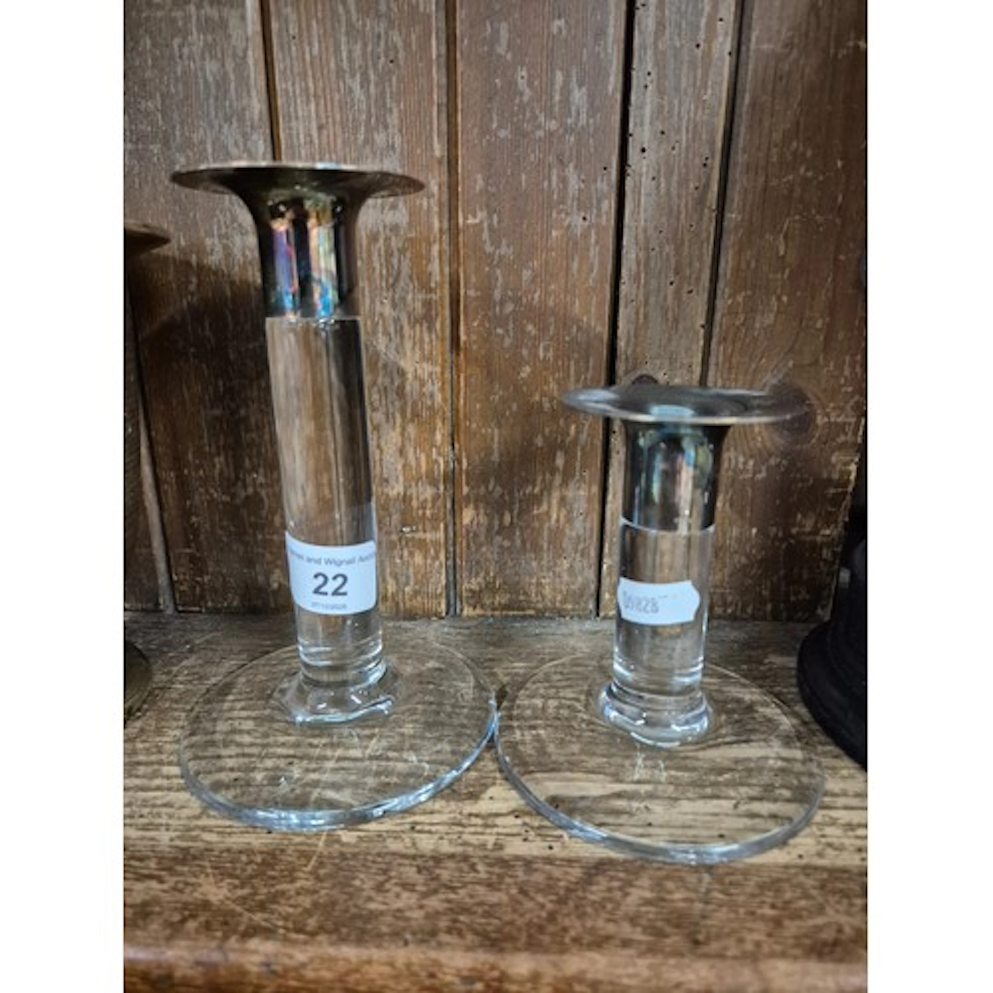 2 glass candle sticks with plated candle holders.