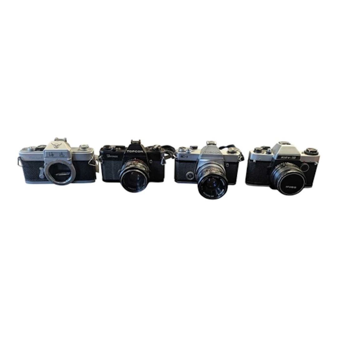 A collection of vintage 20th century 35mm SLR cameras. The c...