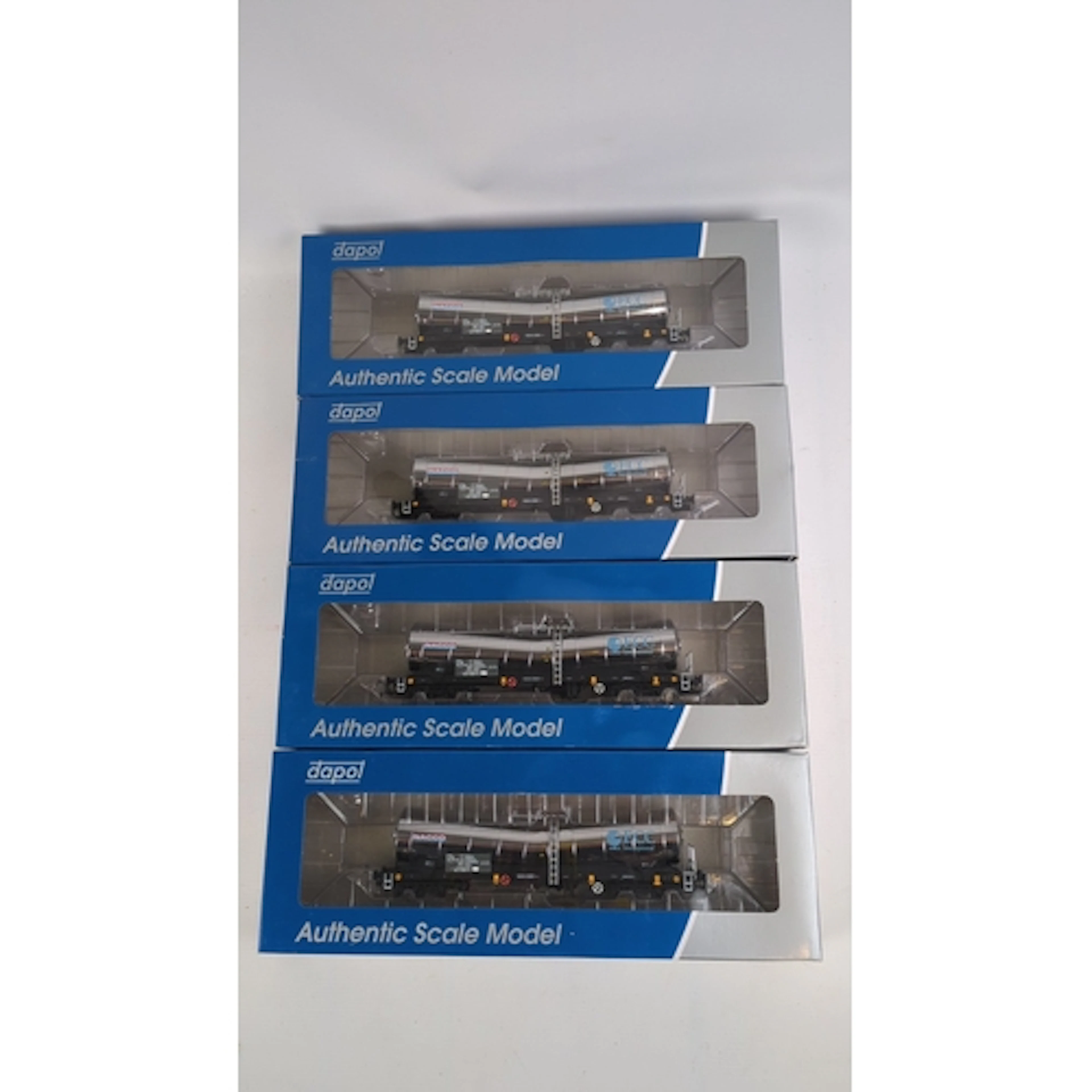 4 x Dapol OO-gauge ‘Silver Bullet’ tanker wagons, Nacco/ECC ...