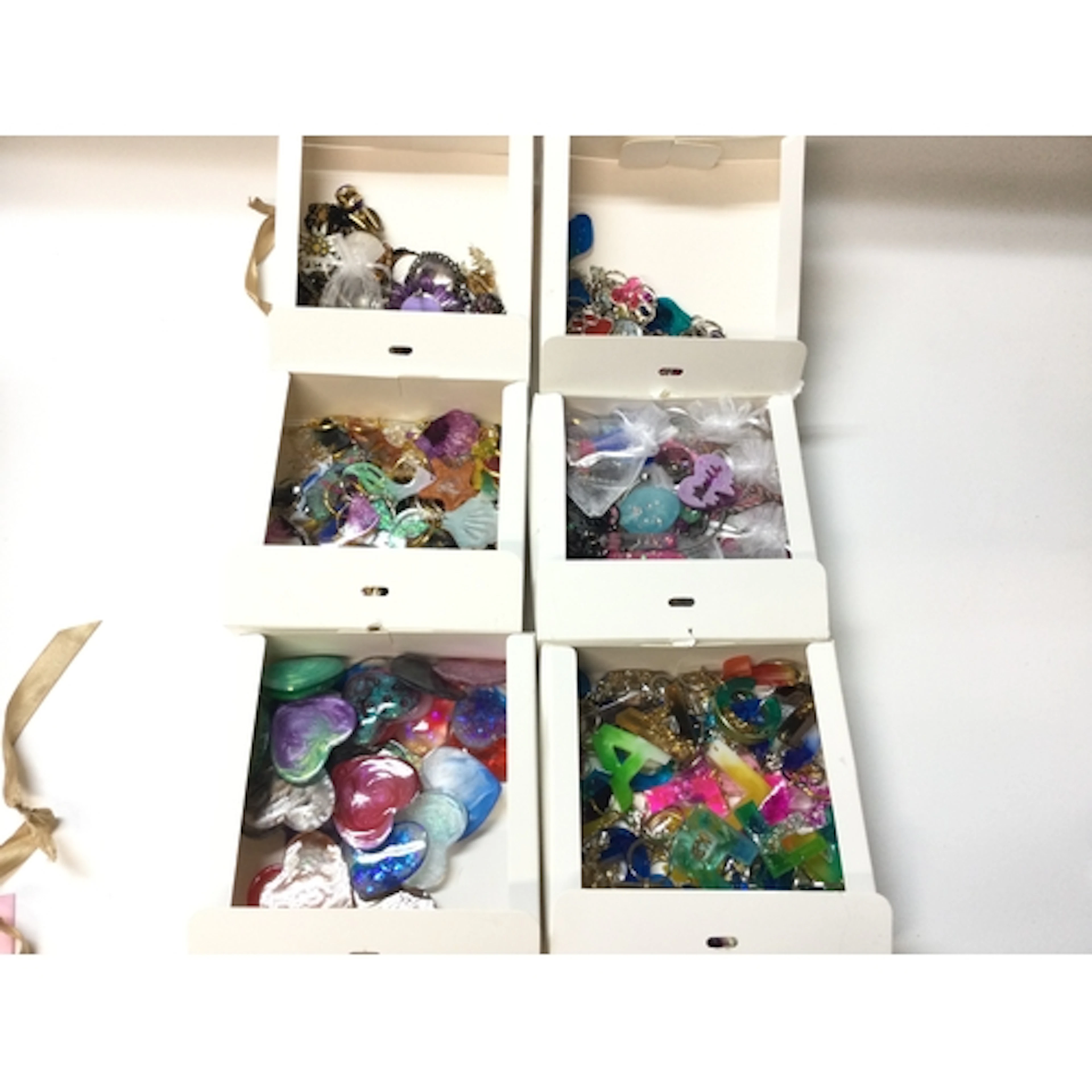 Quantity key rings and and dress jewellery (six boxes)