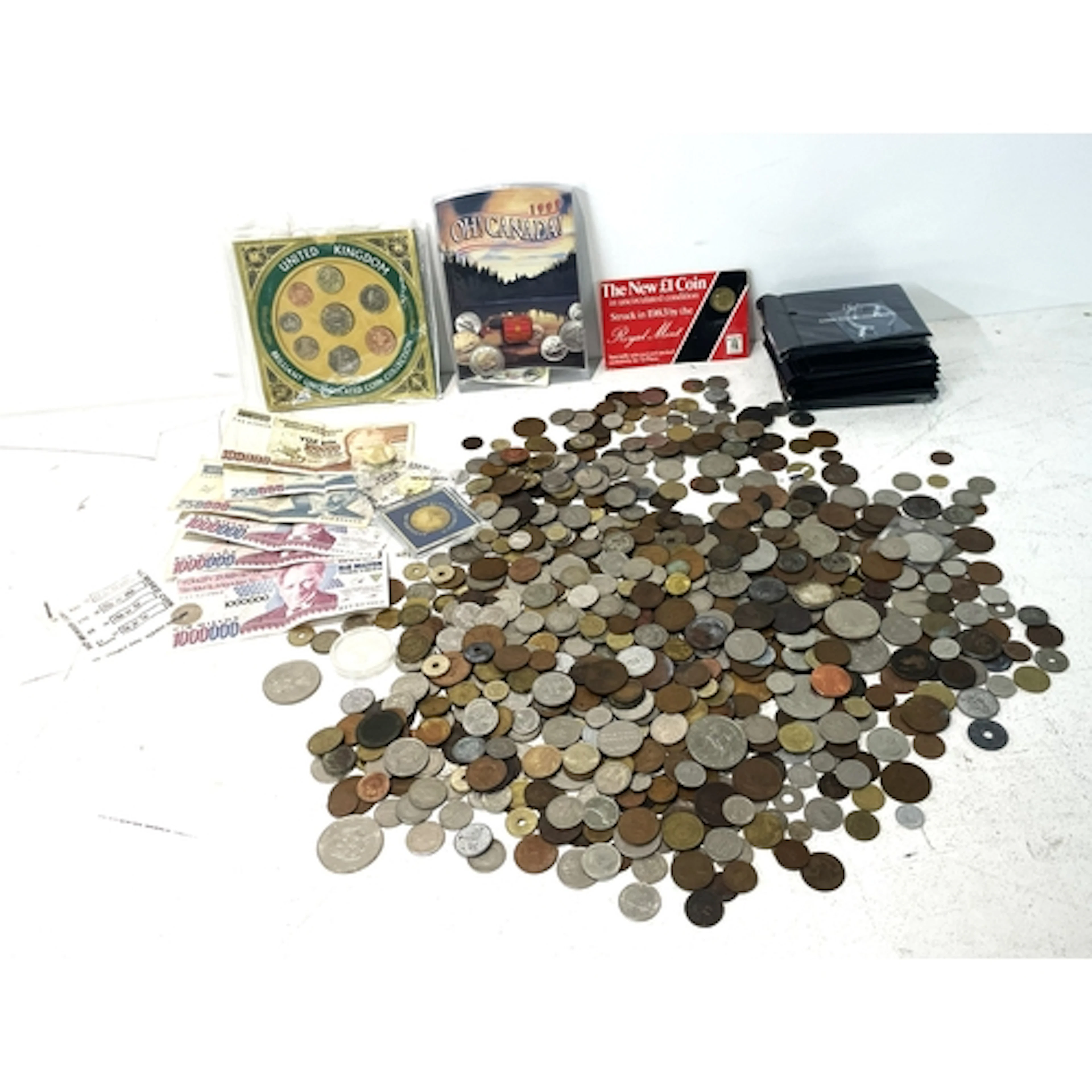 A collection of coins and bank notes from around the world t...