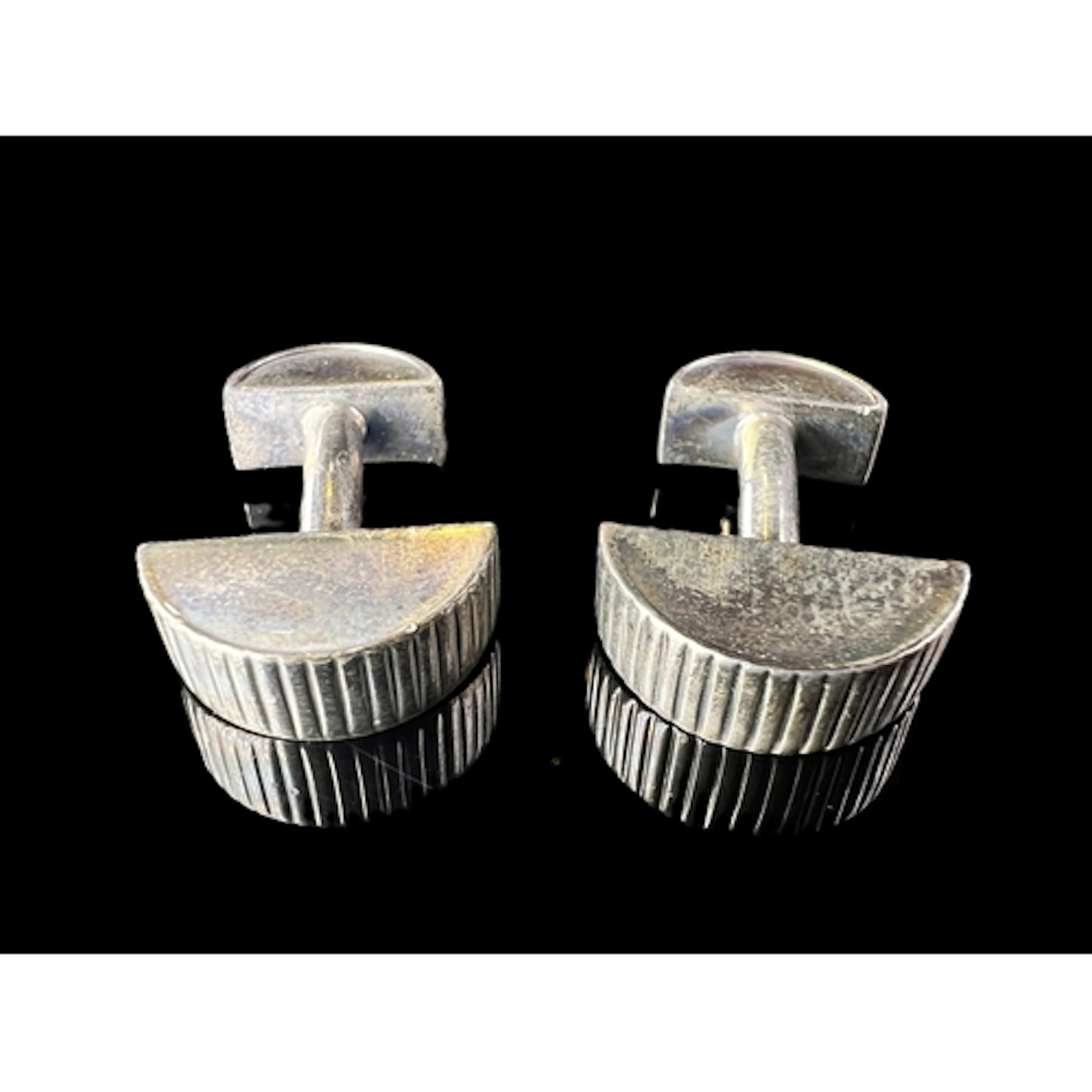 A pair of Tiffany and Co white metal cufflinks with half moo...