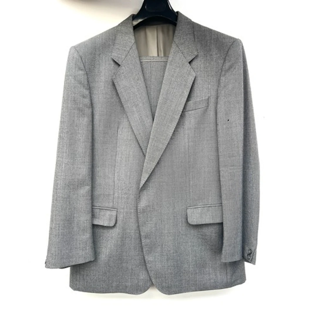 An Alfred Honney two piece grey wool suit (small moth hole),...