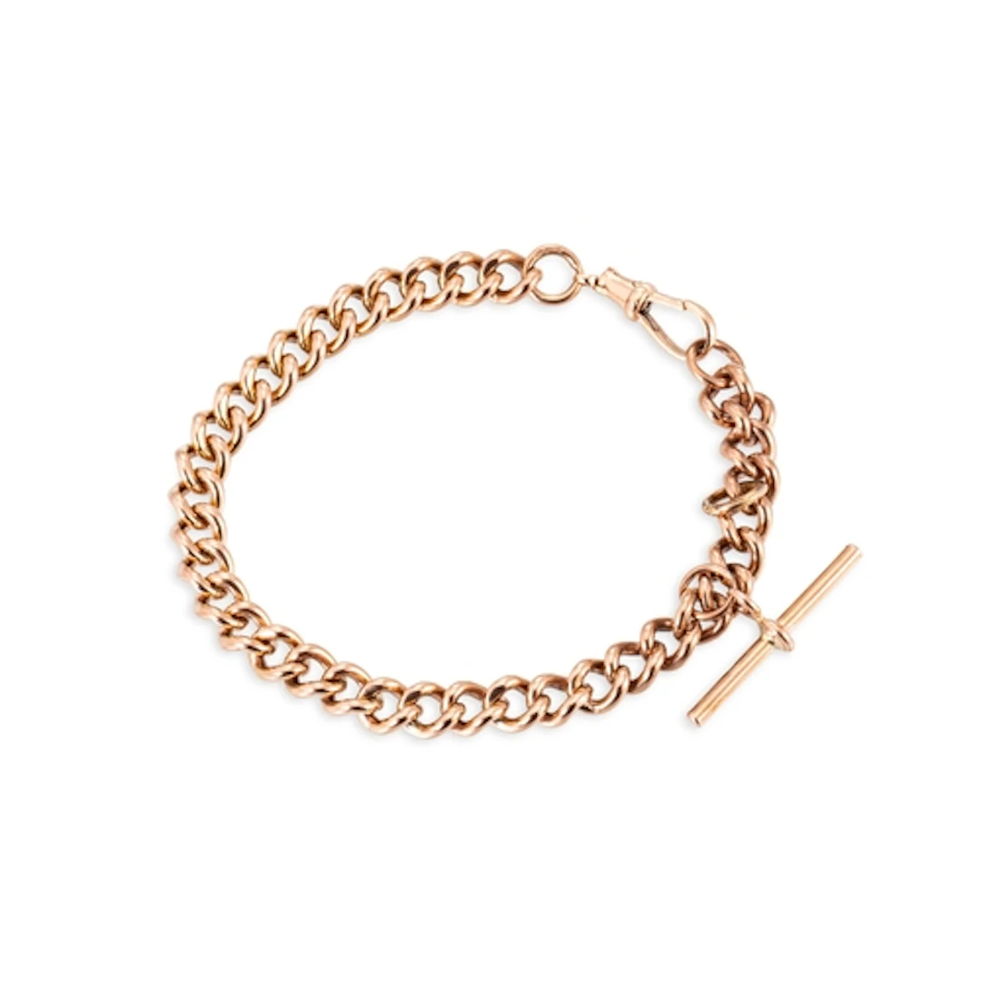 A 9CT GOLD CURB LNIK BRACELET, with T-bar, 30 g. gw