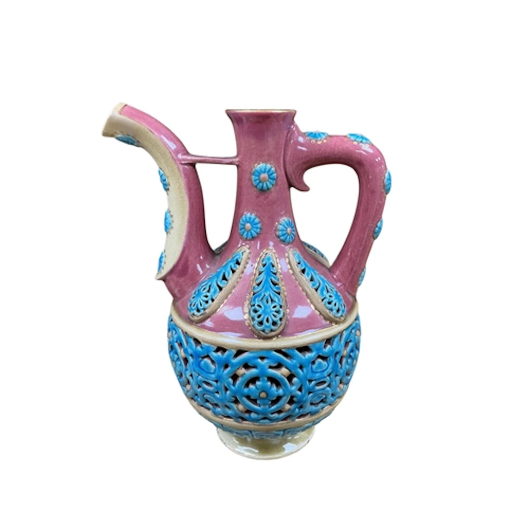 A Hungarian Zsolnay Pecs reticulated ewer, stamped to the ba...