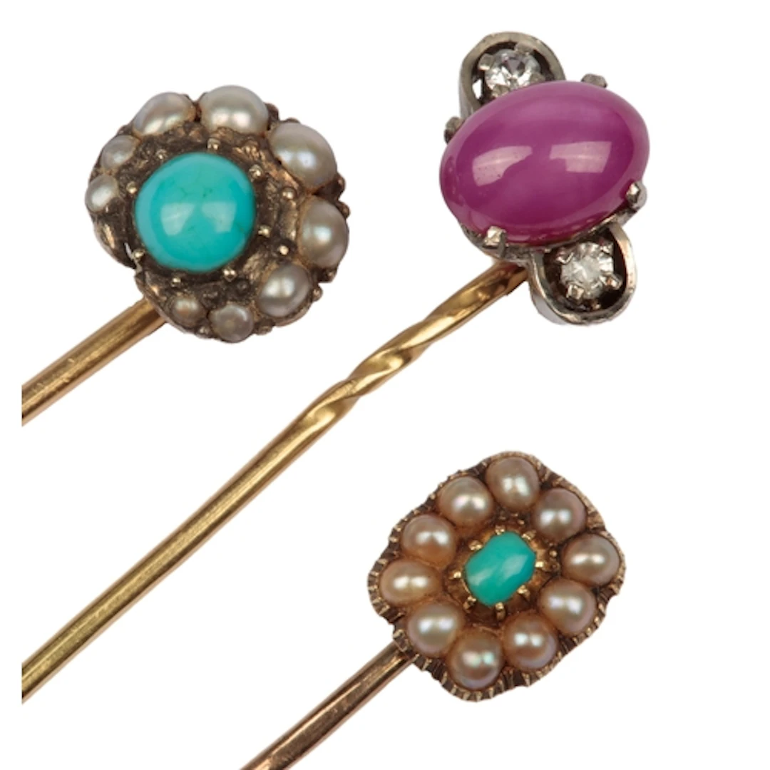Three stick pins, early-mid 20th century, comprising: two st...