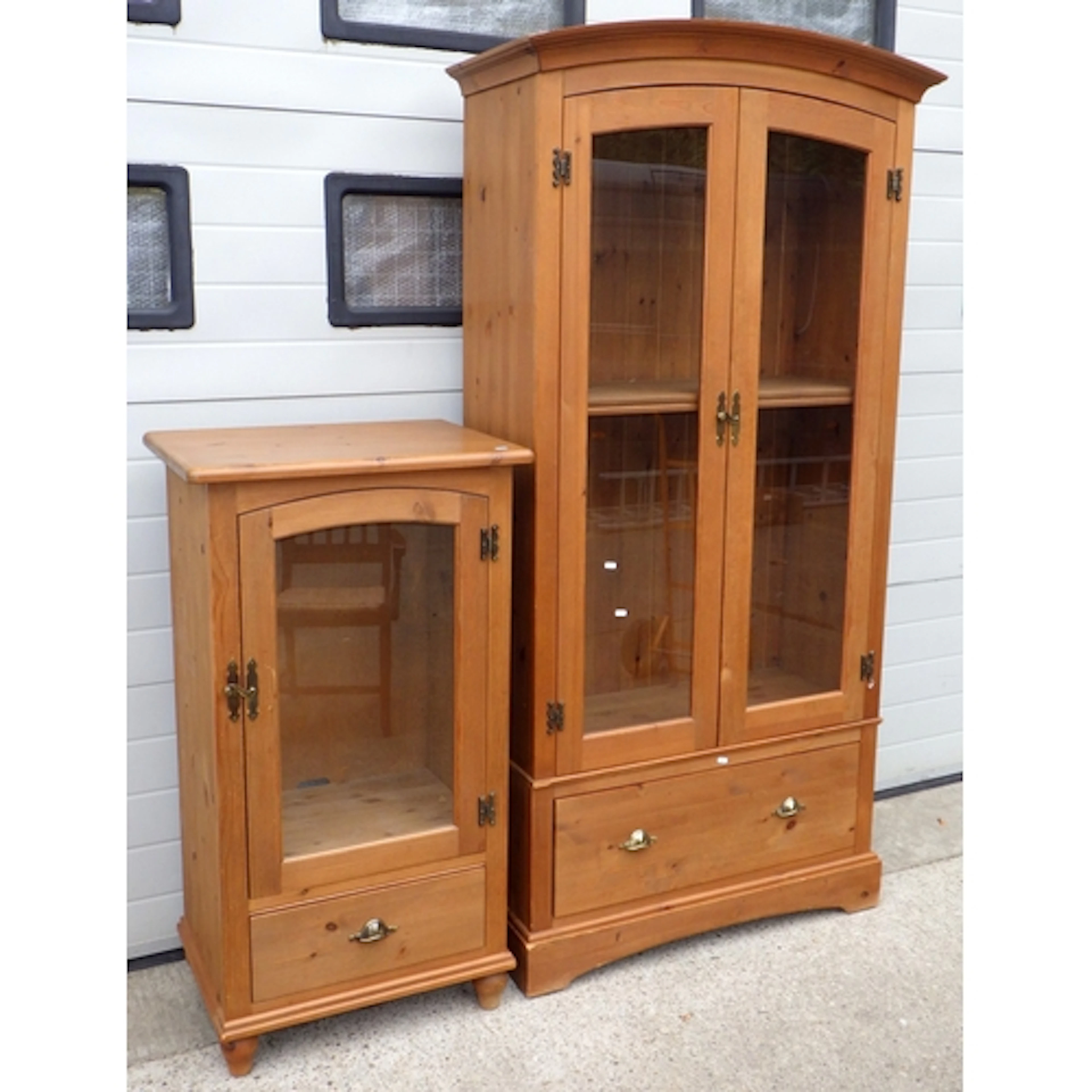 A Marks & Spencer tall modern pine cabinet together with a p...