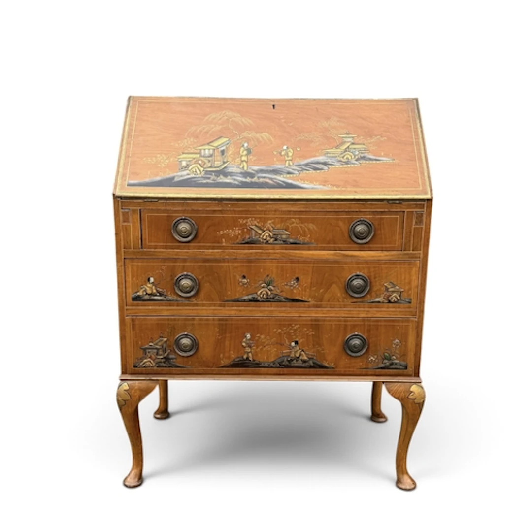A 20TH CENTURY CHINOISERIE DECORATED BUREAU The compartments...