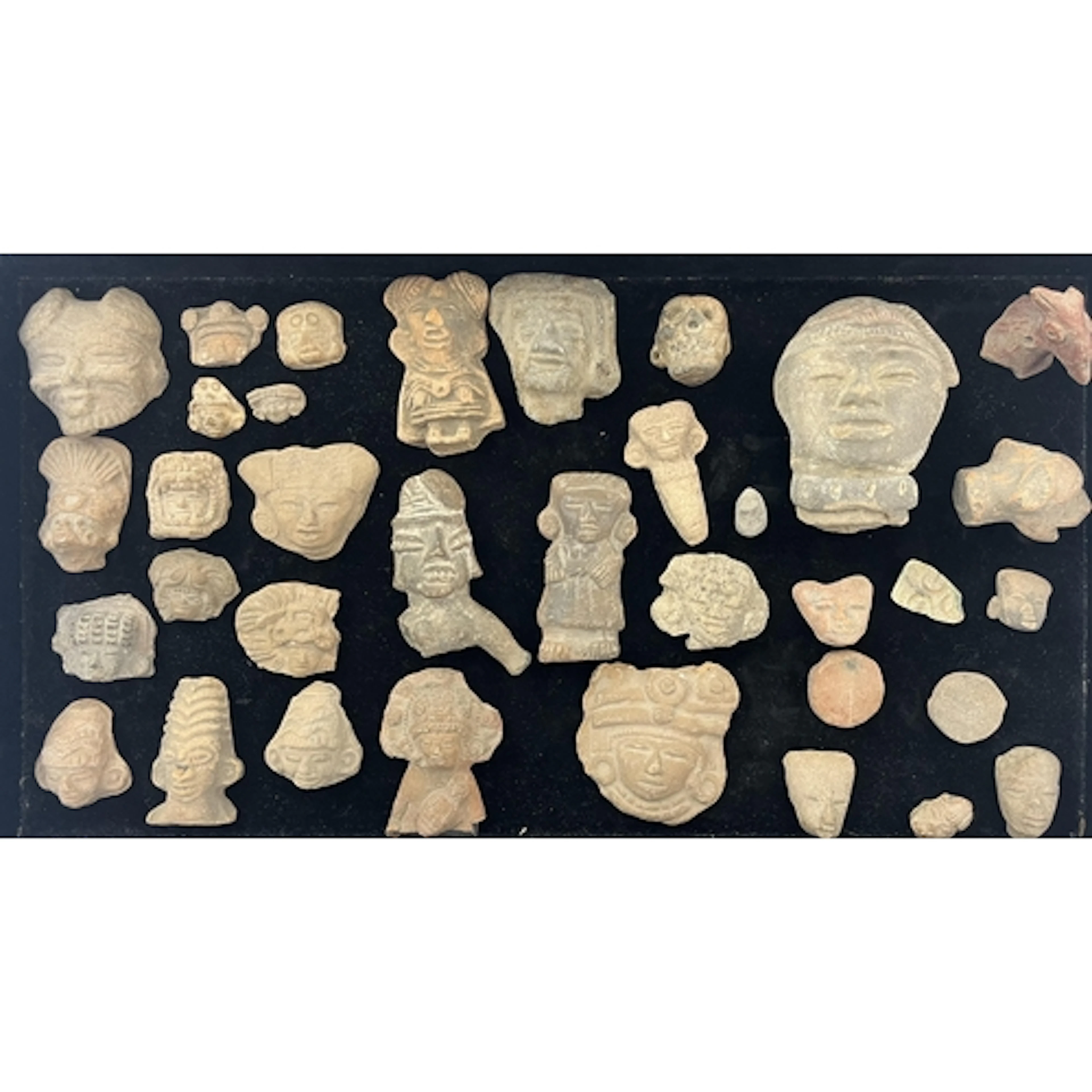 A large group of Pre-Columbian Aztec terracotta heads and fi...
