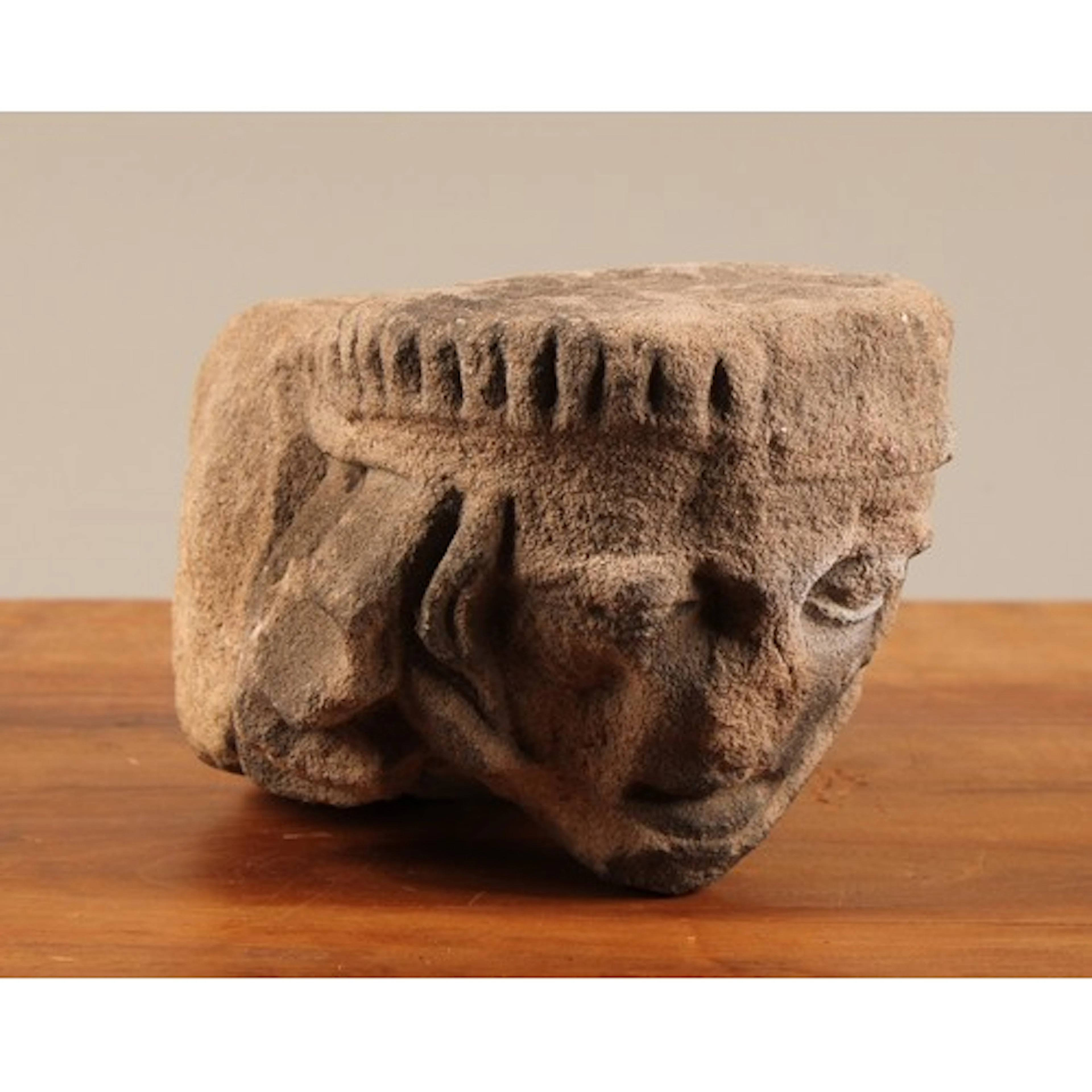 A 15th century sandstone corbel, carved with the head of a g...