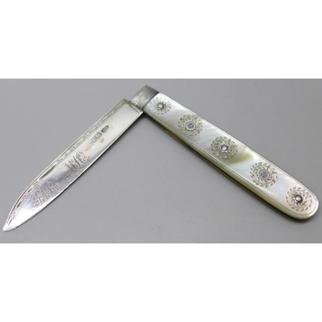 A William IV carved mother of pearl fruit knife with a silve...