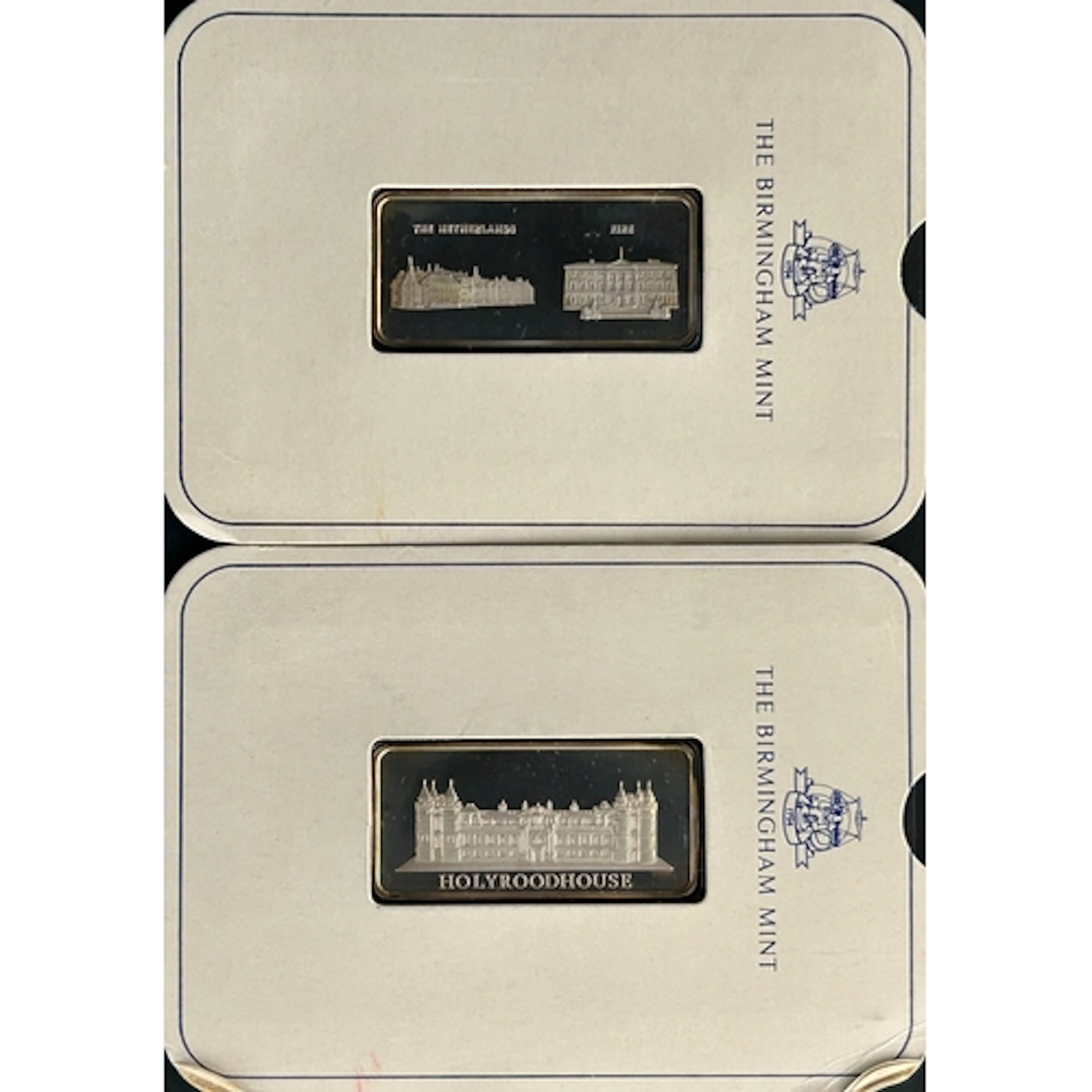 A pair of Birmingham Mint Royal Palaces series solid sterlin...