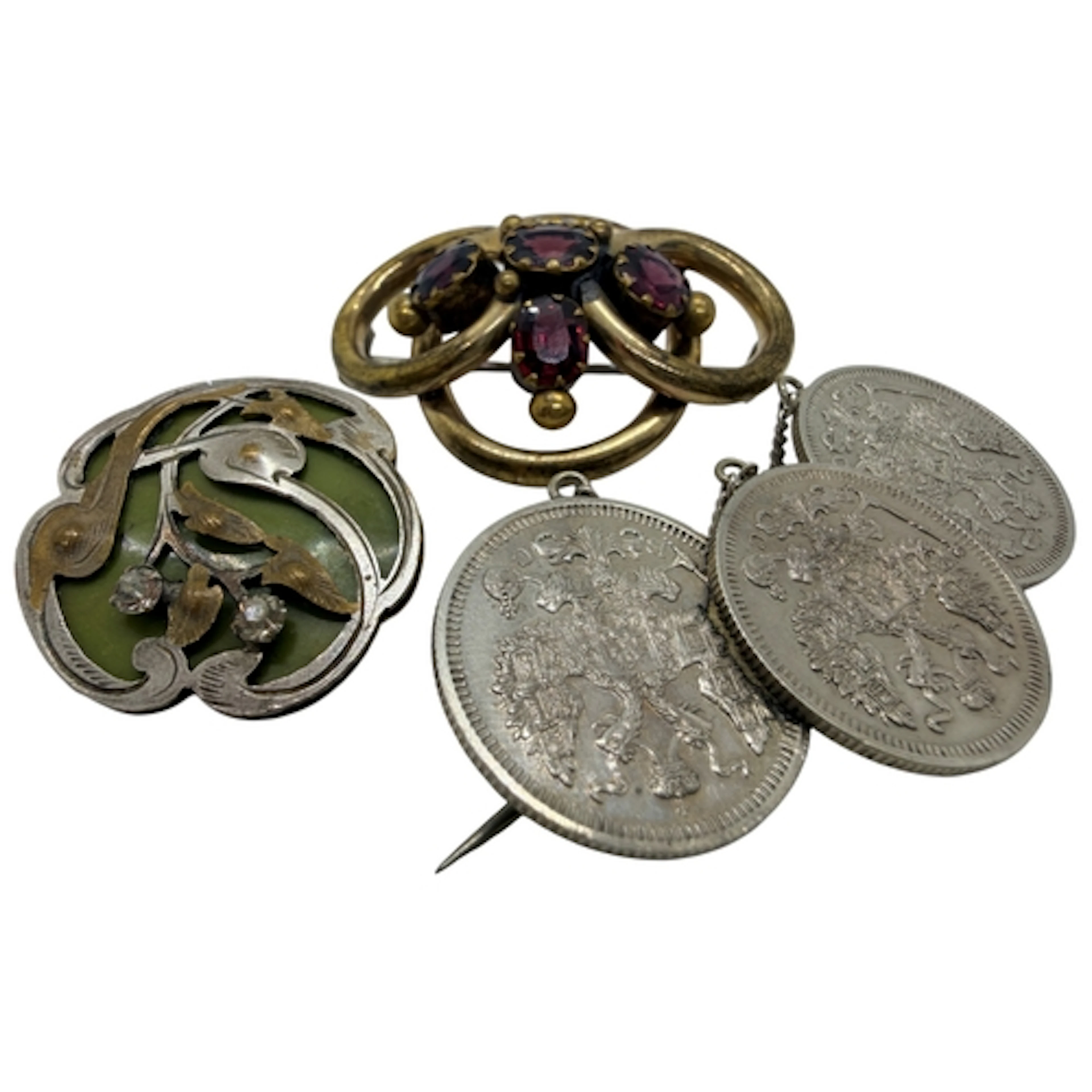 An antique solid silver Russian coin brooch, set with three ...