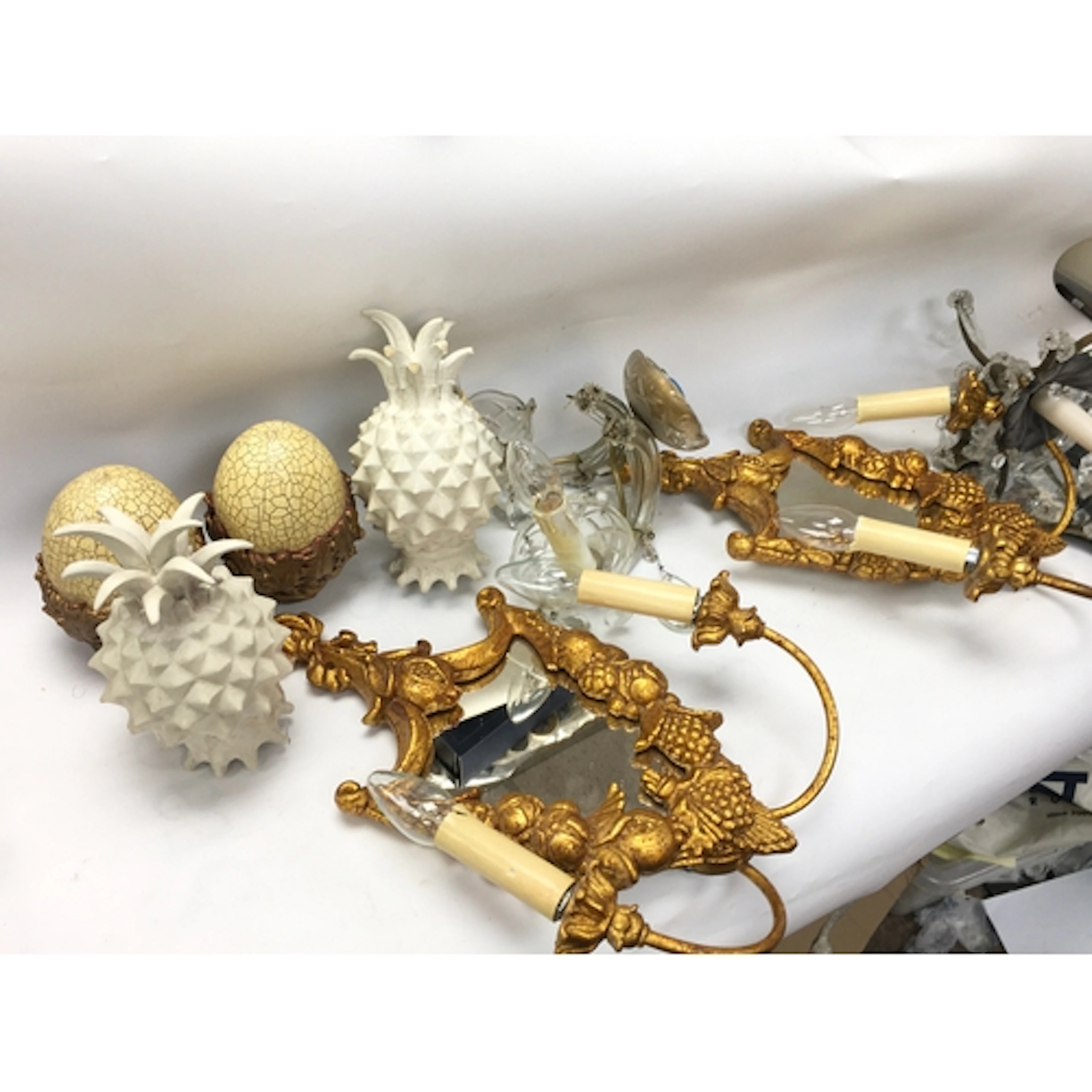 Interior design pieces including lights and curtain finials