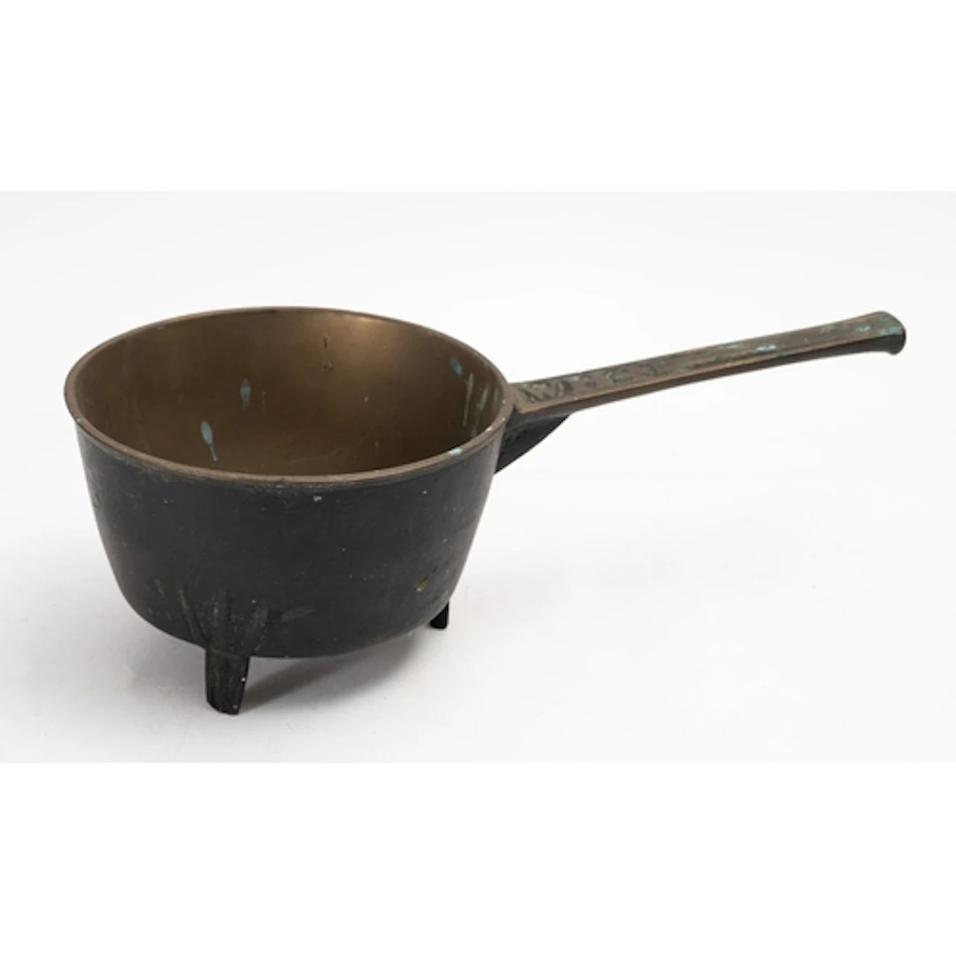 A 19th Century Bronze Skillet. The round bowl on straight le...