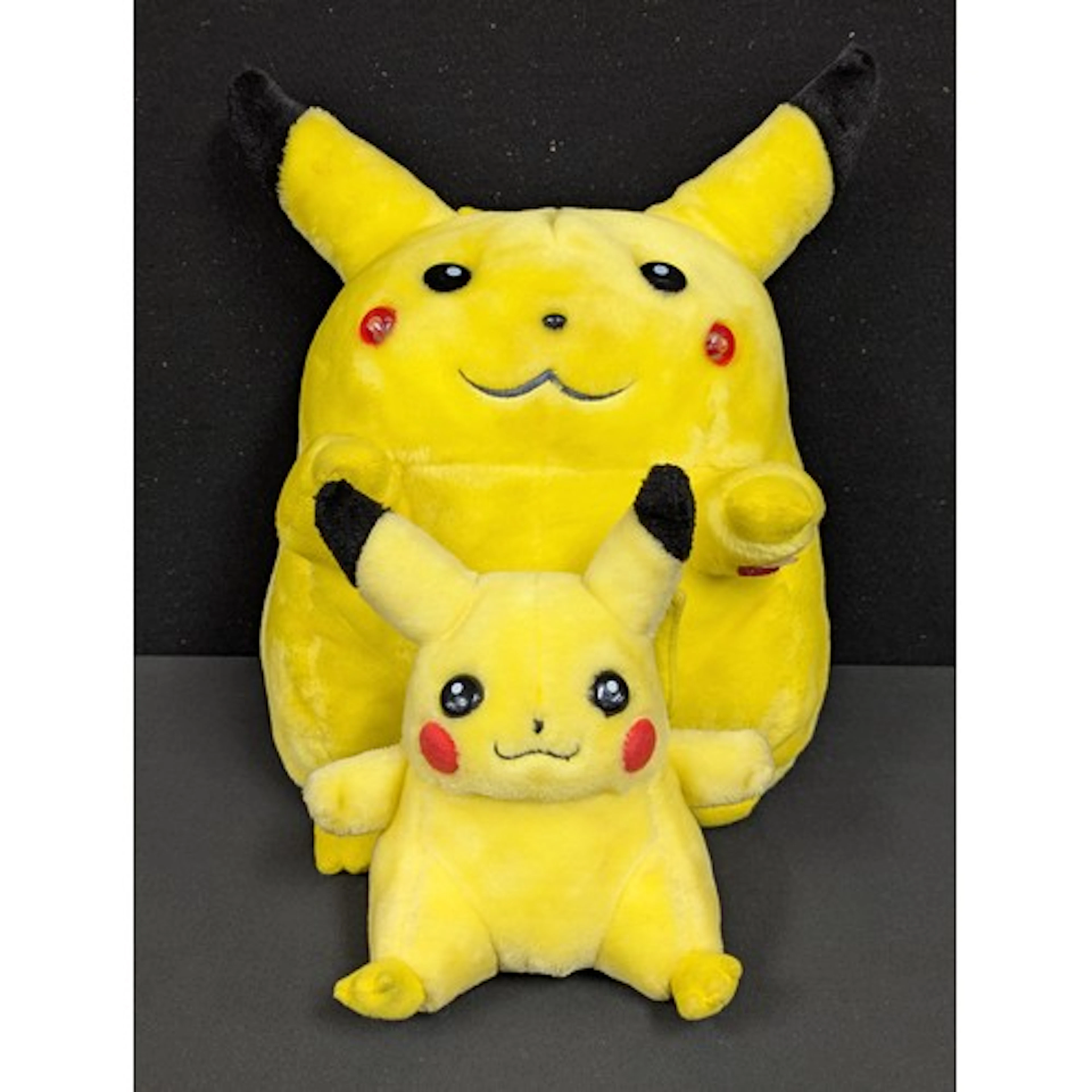 A Pokemon plush toy, Pikachu, by Banpresto; another smaller,...