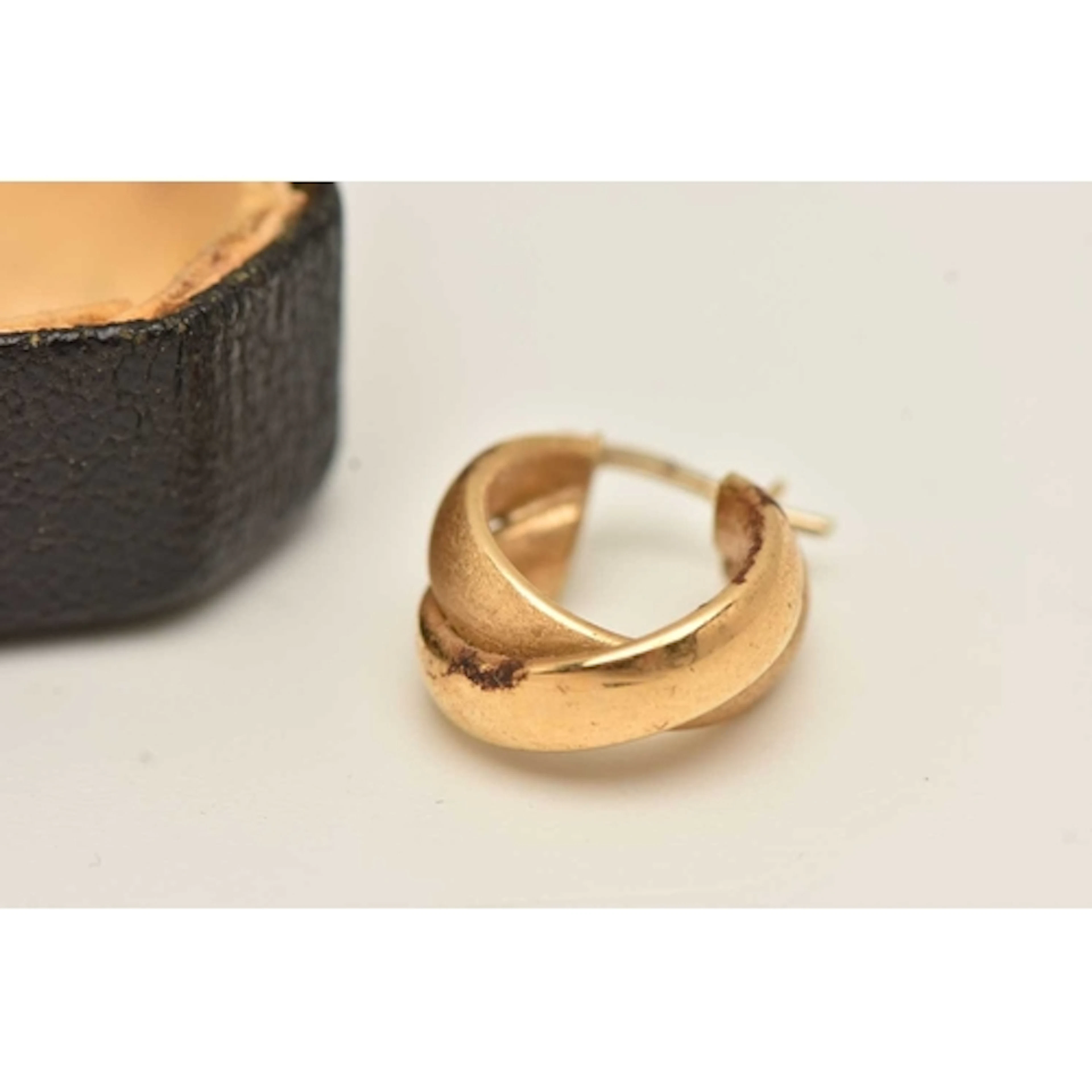 A SINGLE 18CT GOLD EARRING, a yellow gold double band hoop e...
