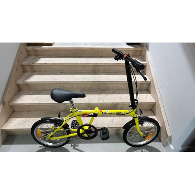 Yellow coloured folding bike.