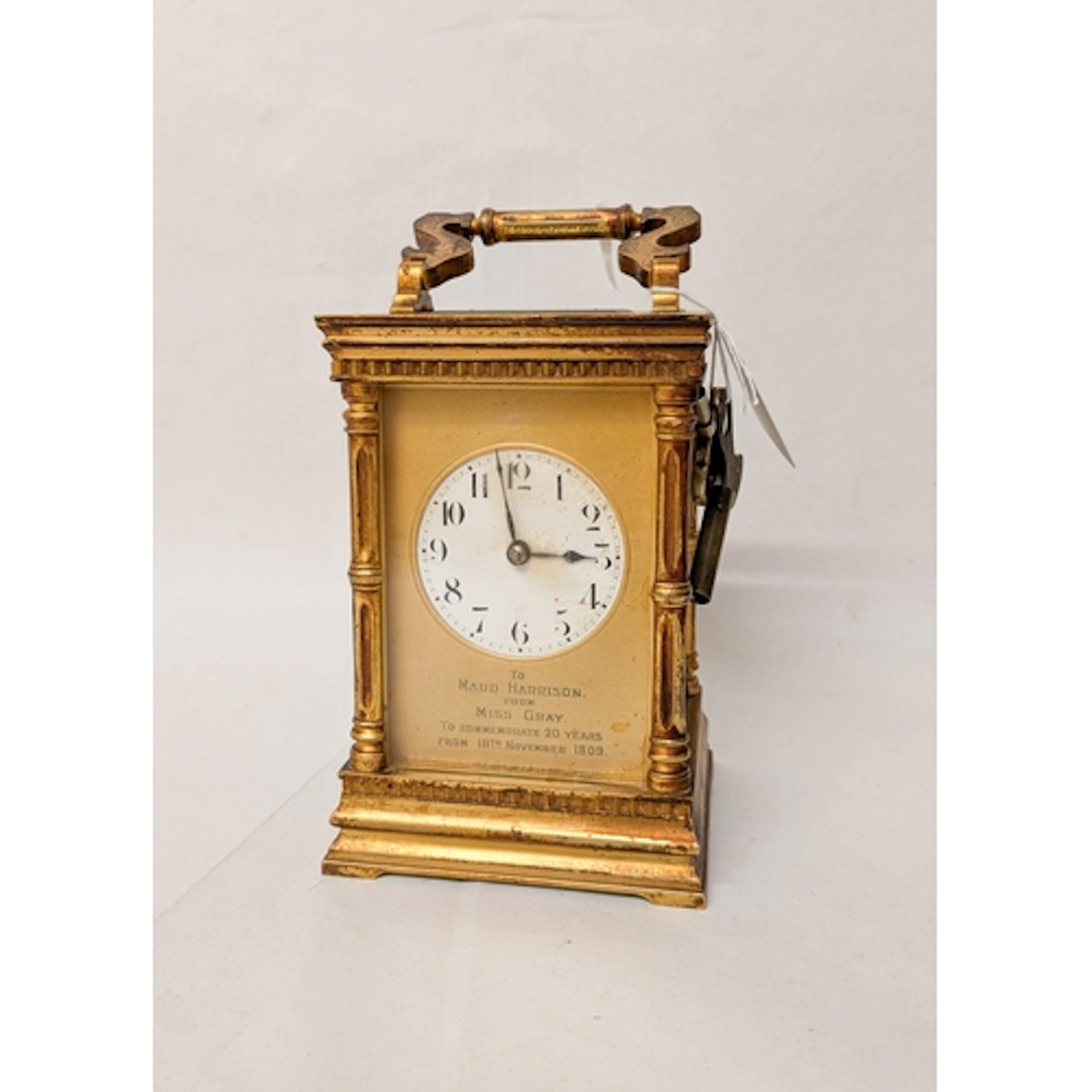 A late Victorian gilt brass carriage clock with presentation...