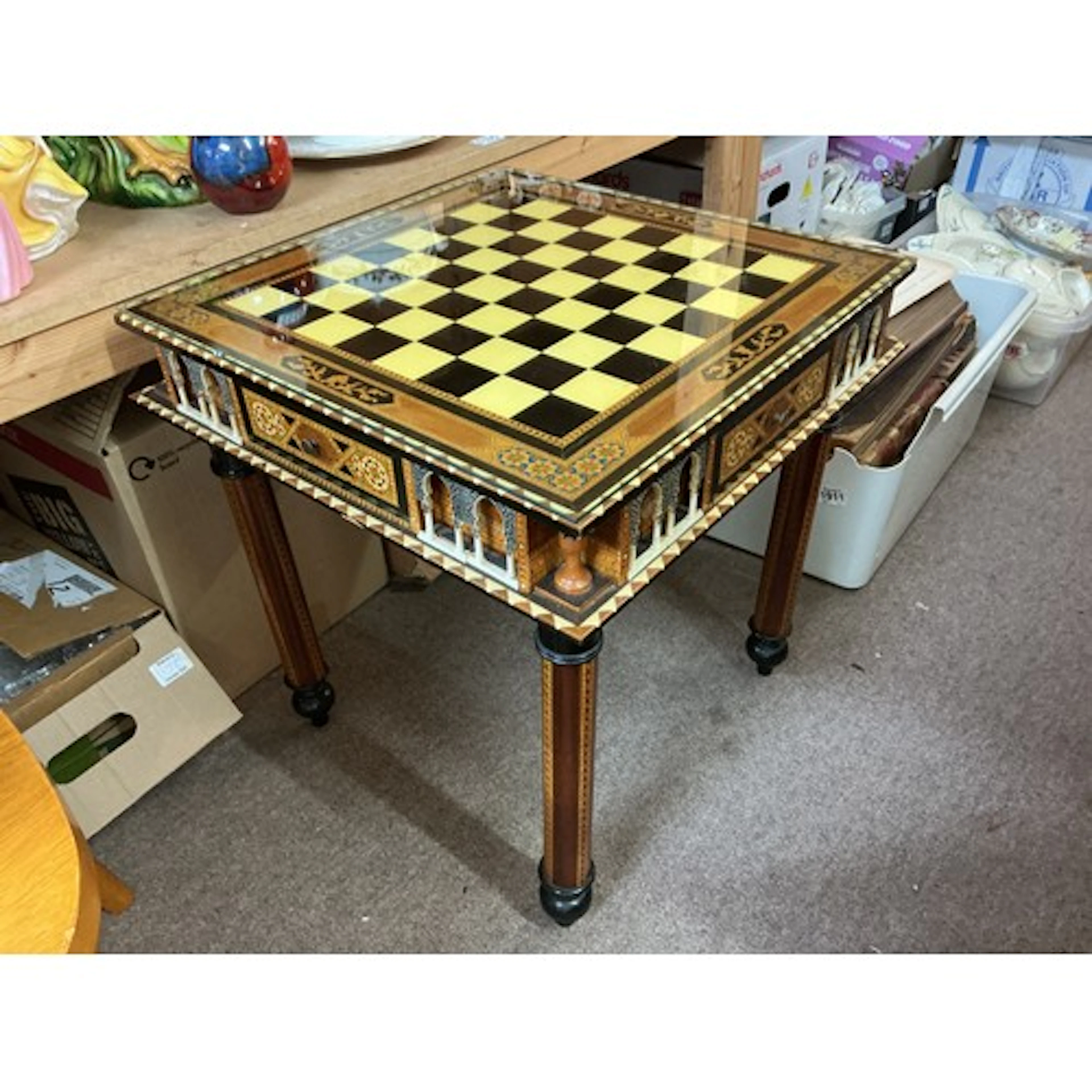 A modern chess table with chess set pieces of classical Troj...