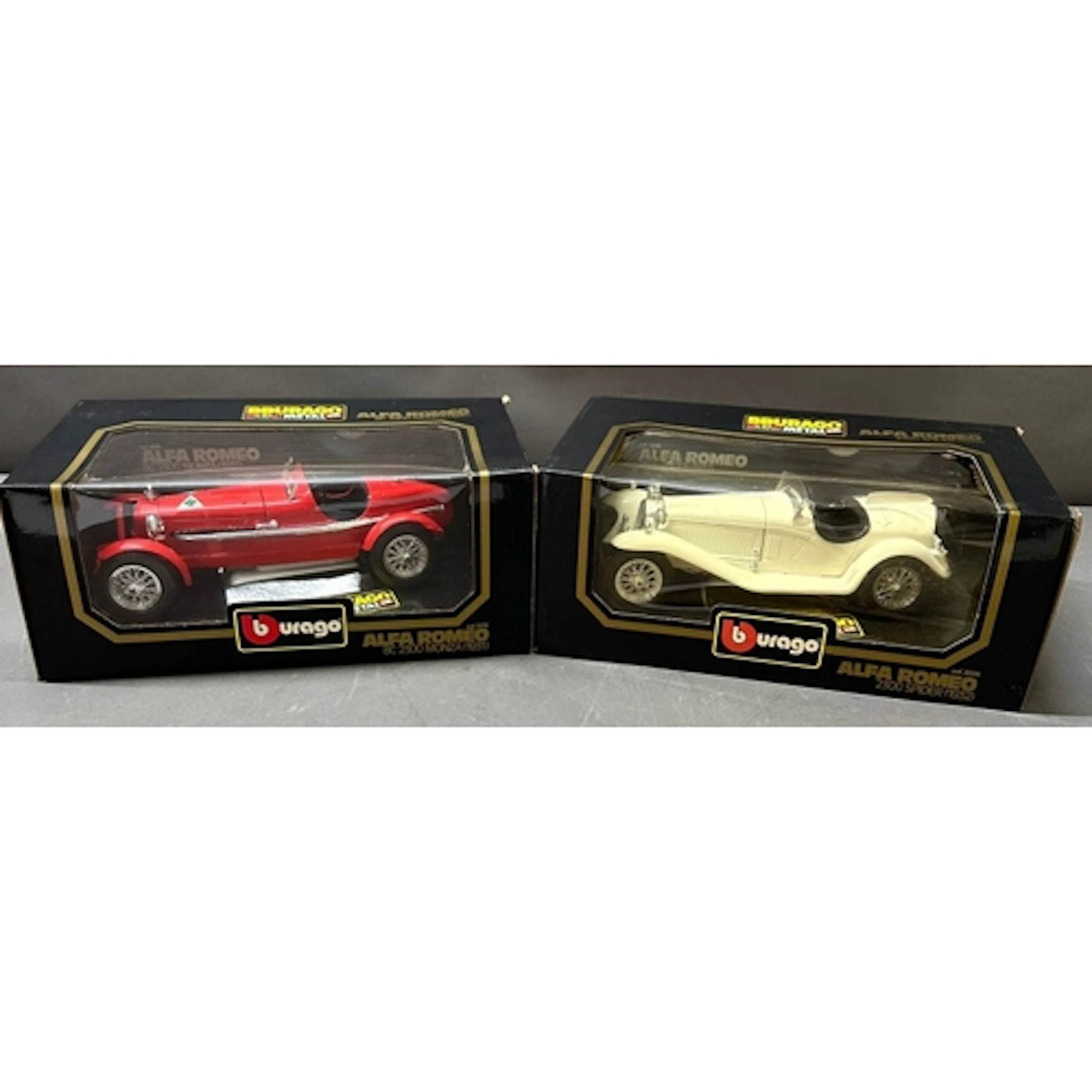 Two Burago die-cast model cars, one Alfa Romeo 8C 2300 Monza...