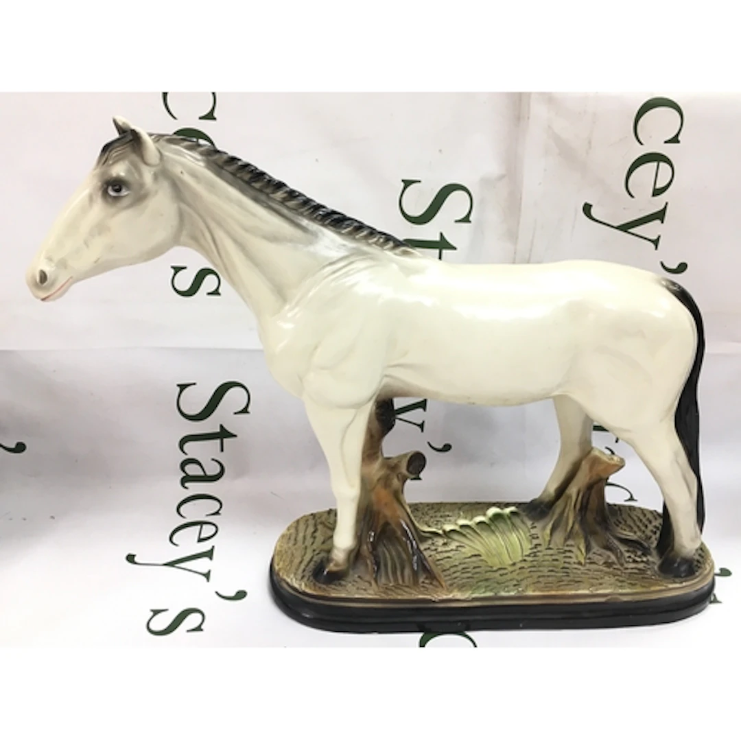 A ceramic horse figure. 34cm tall, 50cm wide. No obvious dam...