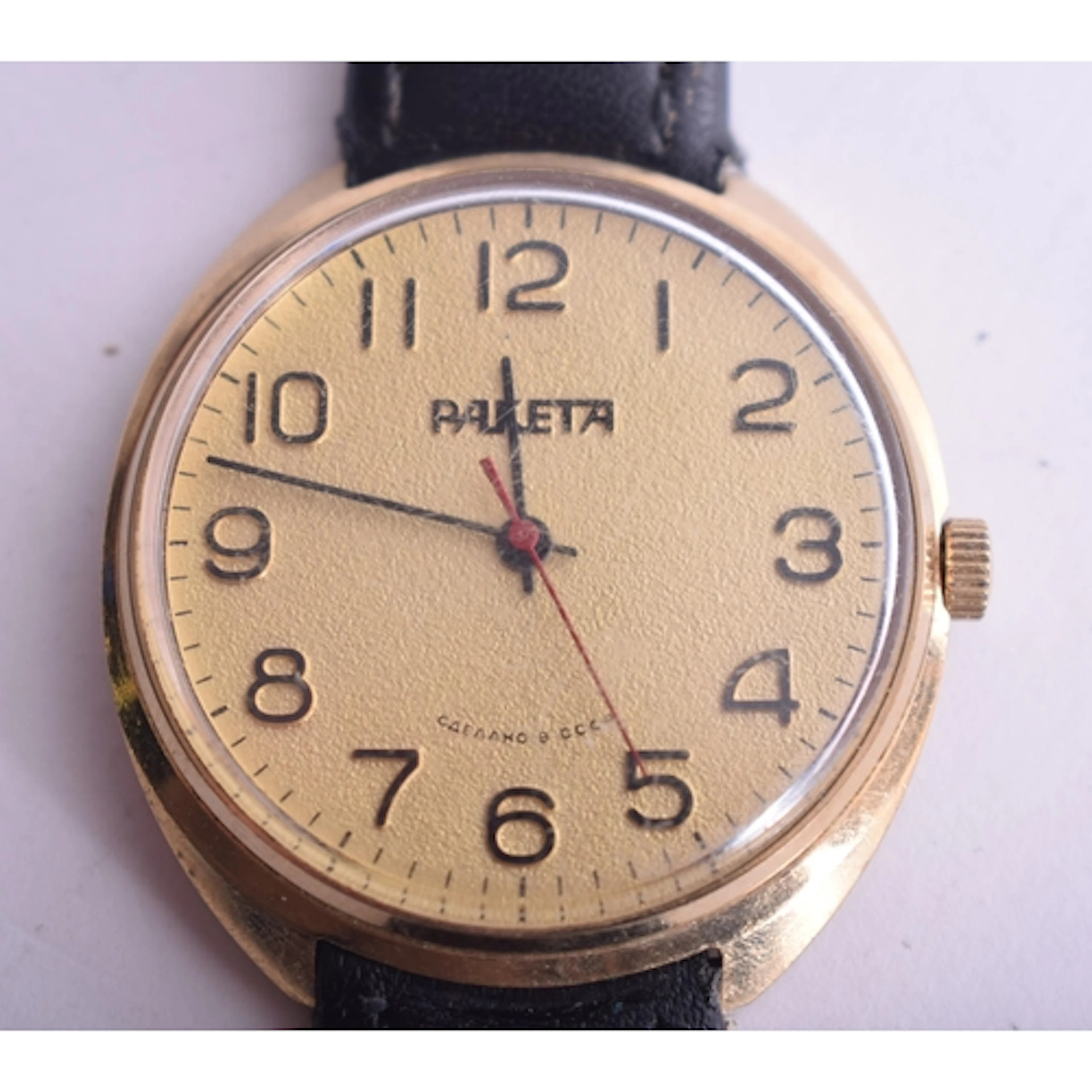 Raketa Gold Tone Hand Wind Watch Working. 4 cm wide.