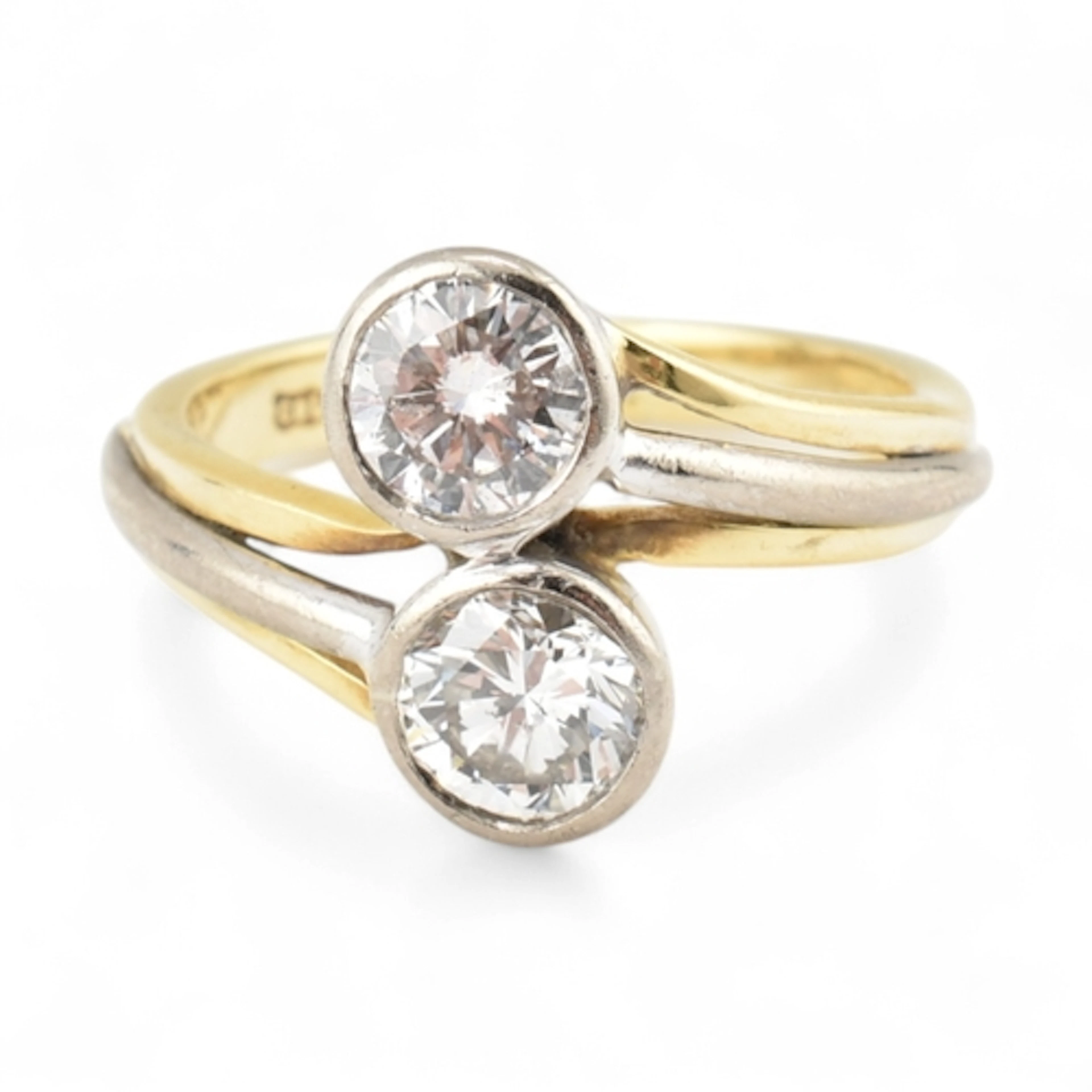 Hallmarked 18ct bi colour gold and diamond tois et moi ring....