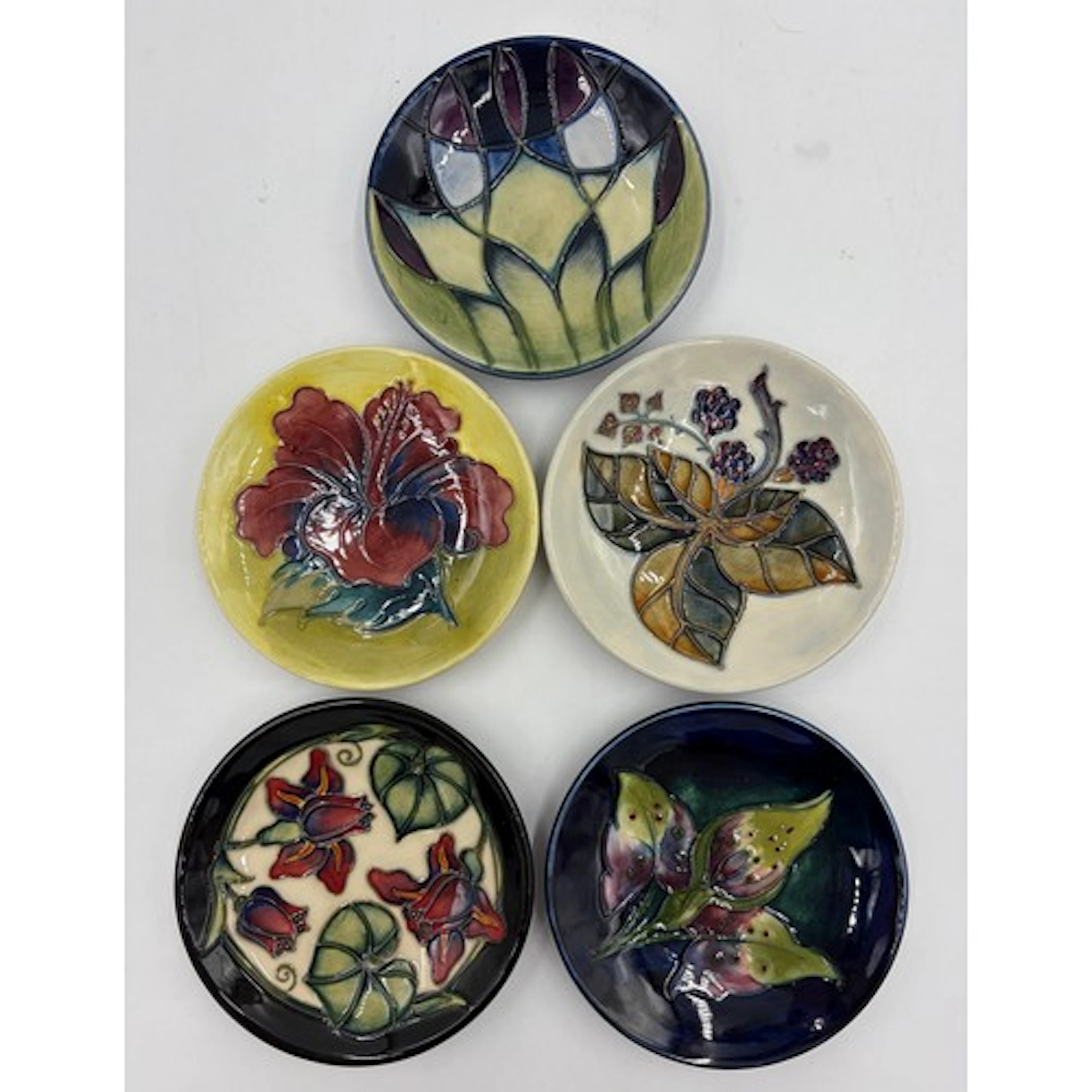 A collection of Moorcroft pottery to include 5 x pin dishes....