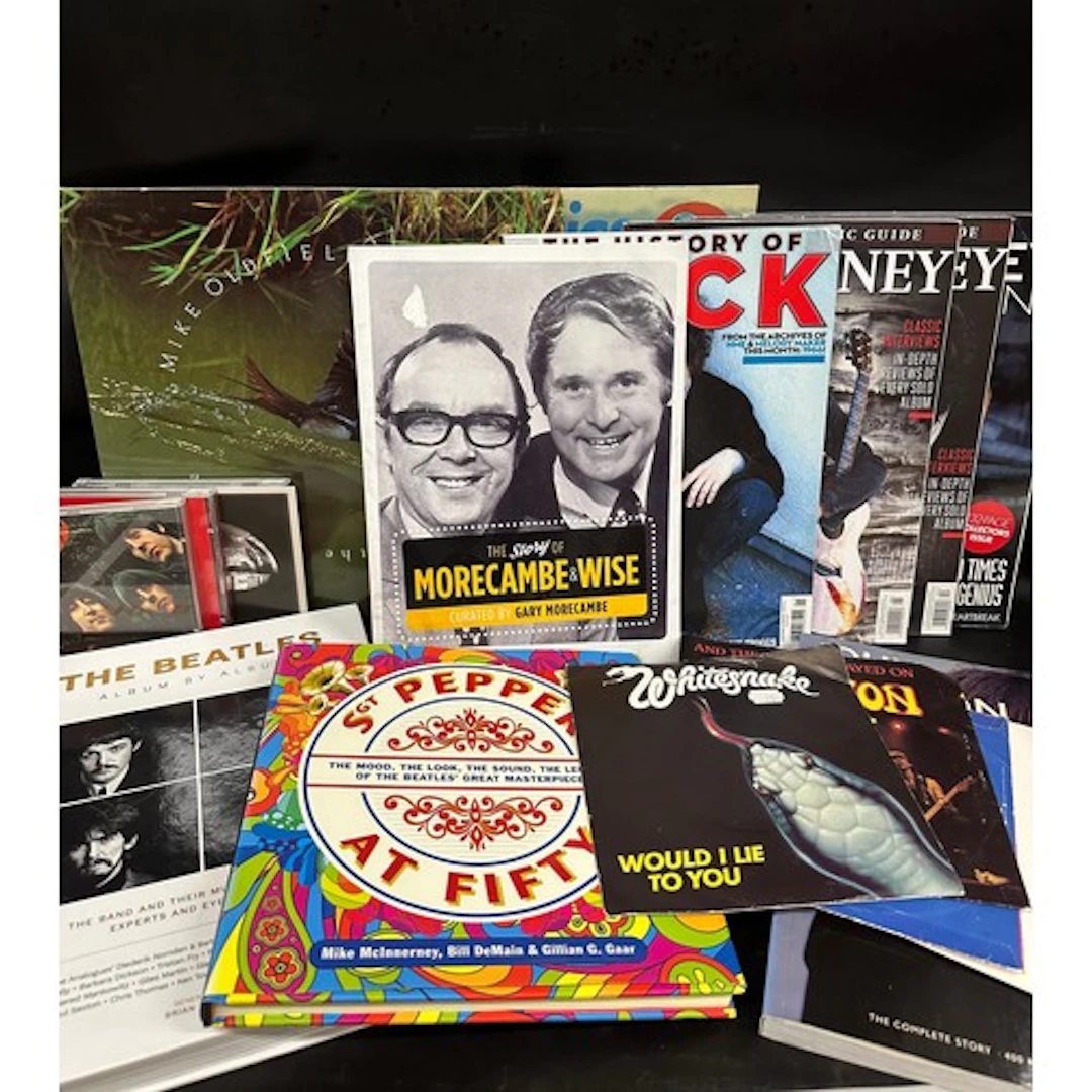A collection of The Beatles books, CDs, LPs, 7" singles to i...