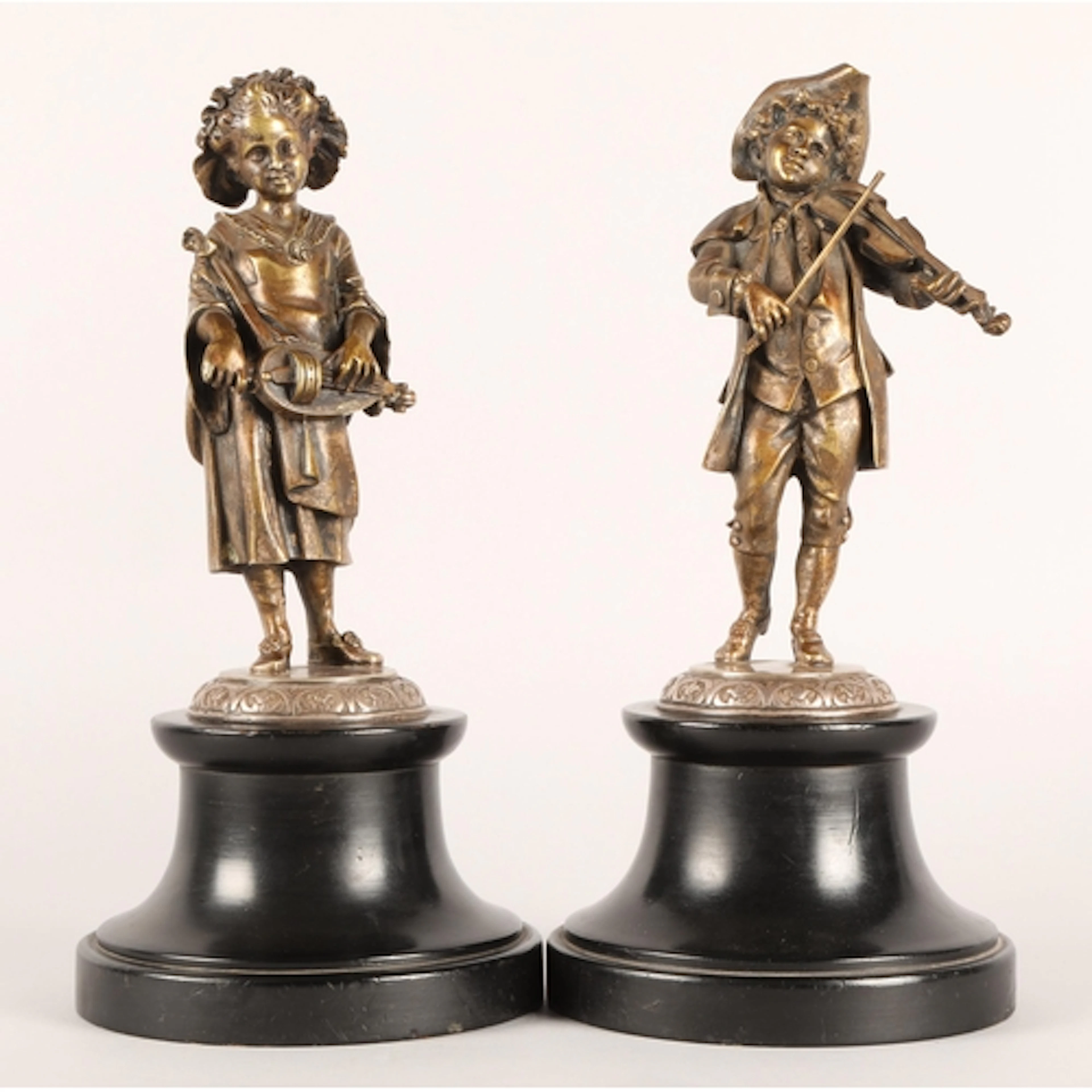 Pair of Victorian cast bronze statues, modelled as a young W...