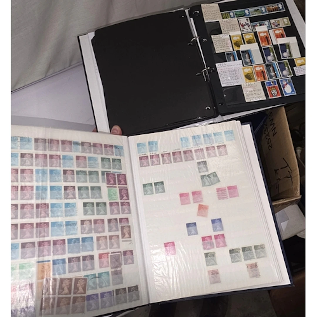 A collection of various GB stamps in albums and on sheets et...