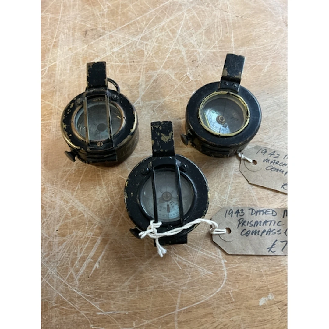 Three WWII Marching compasses with Mother of Pearl dials.