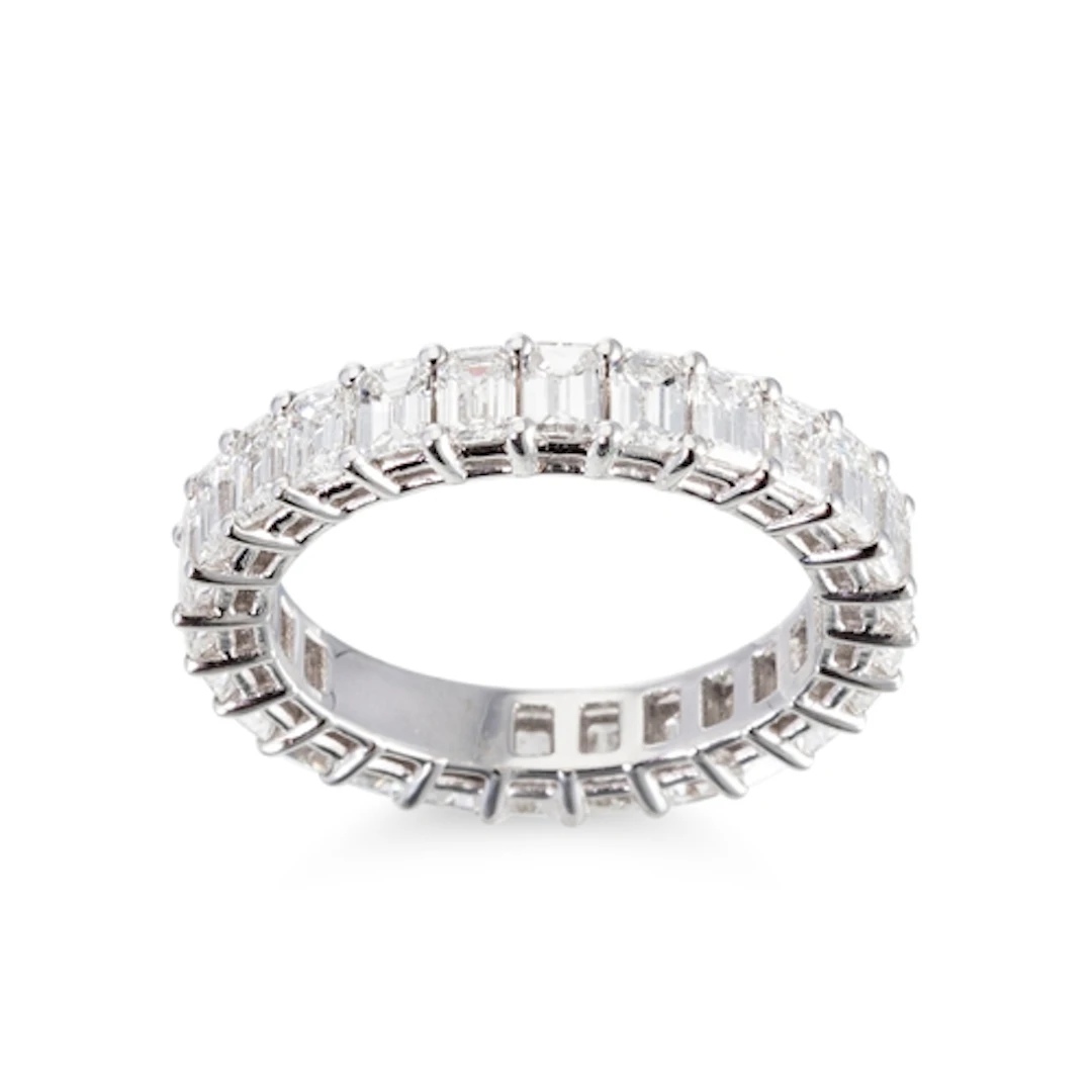 AN EMERALD CUT DIAMOND FULL BANDED ETERNITY RING, the emeral...