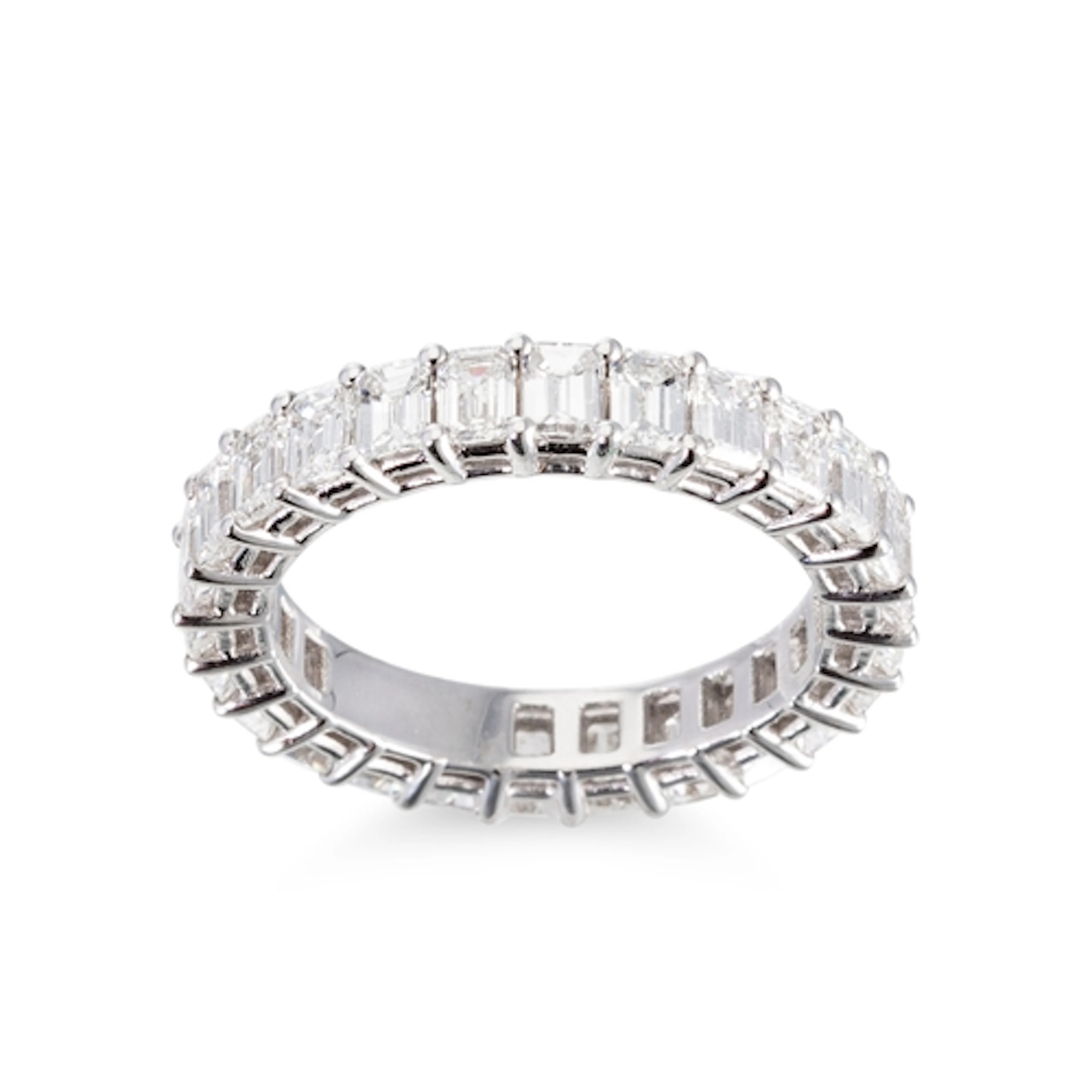 AN EMERALD CUT DIAMOND FULL BANDED ETERNITY RING, the emeral...