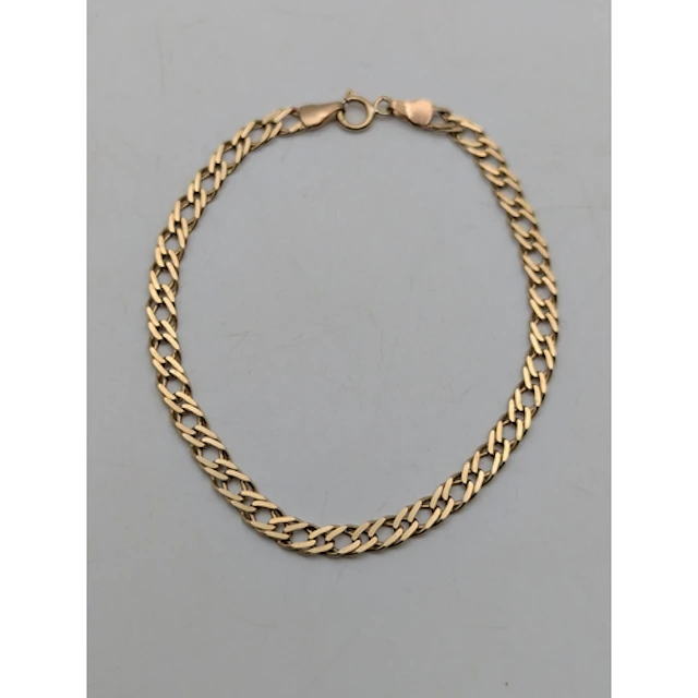A 9ct yellow gold double curb link fancy bracelet, with spri...