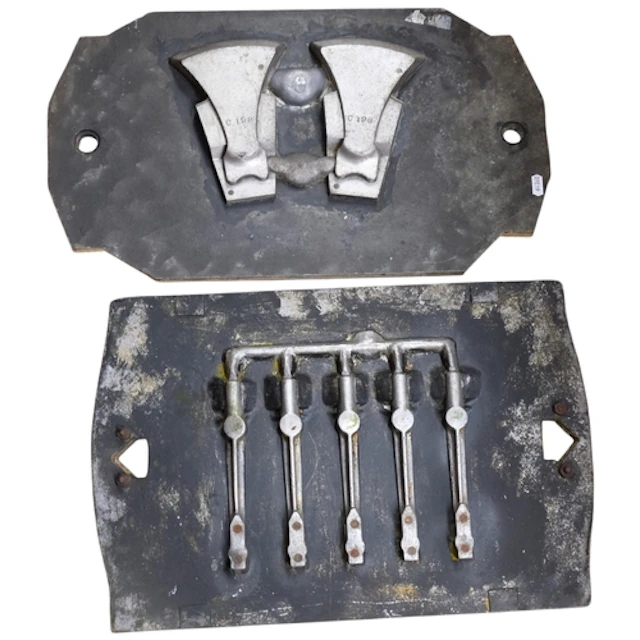 2 heavy cast-metal automotive industry component moulds, lar...