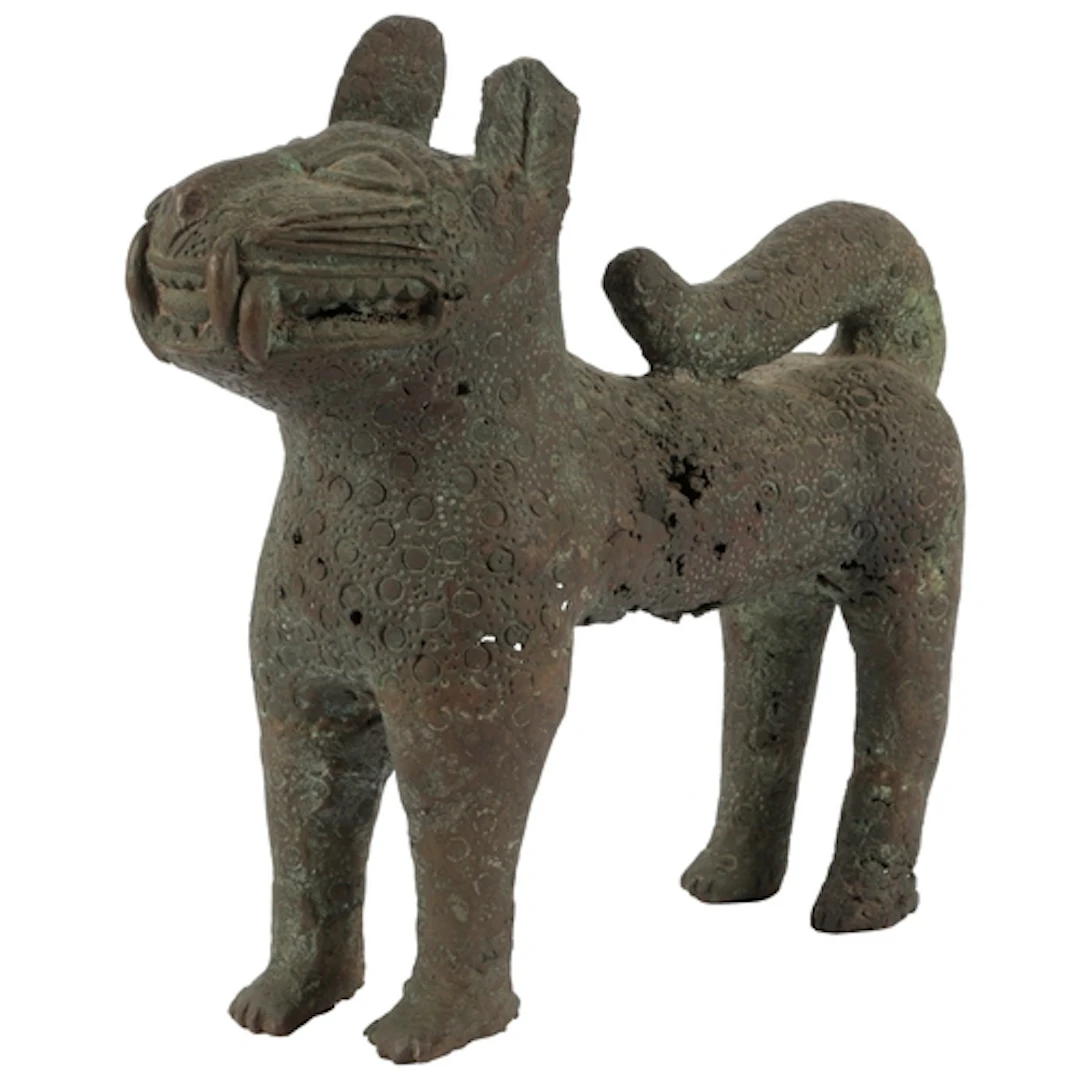 A large Nigerian bronze figure of a leopard, in Benin style,...