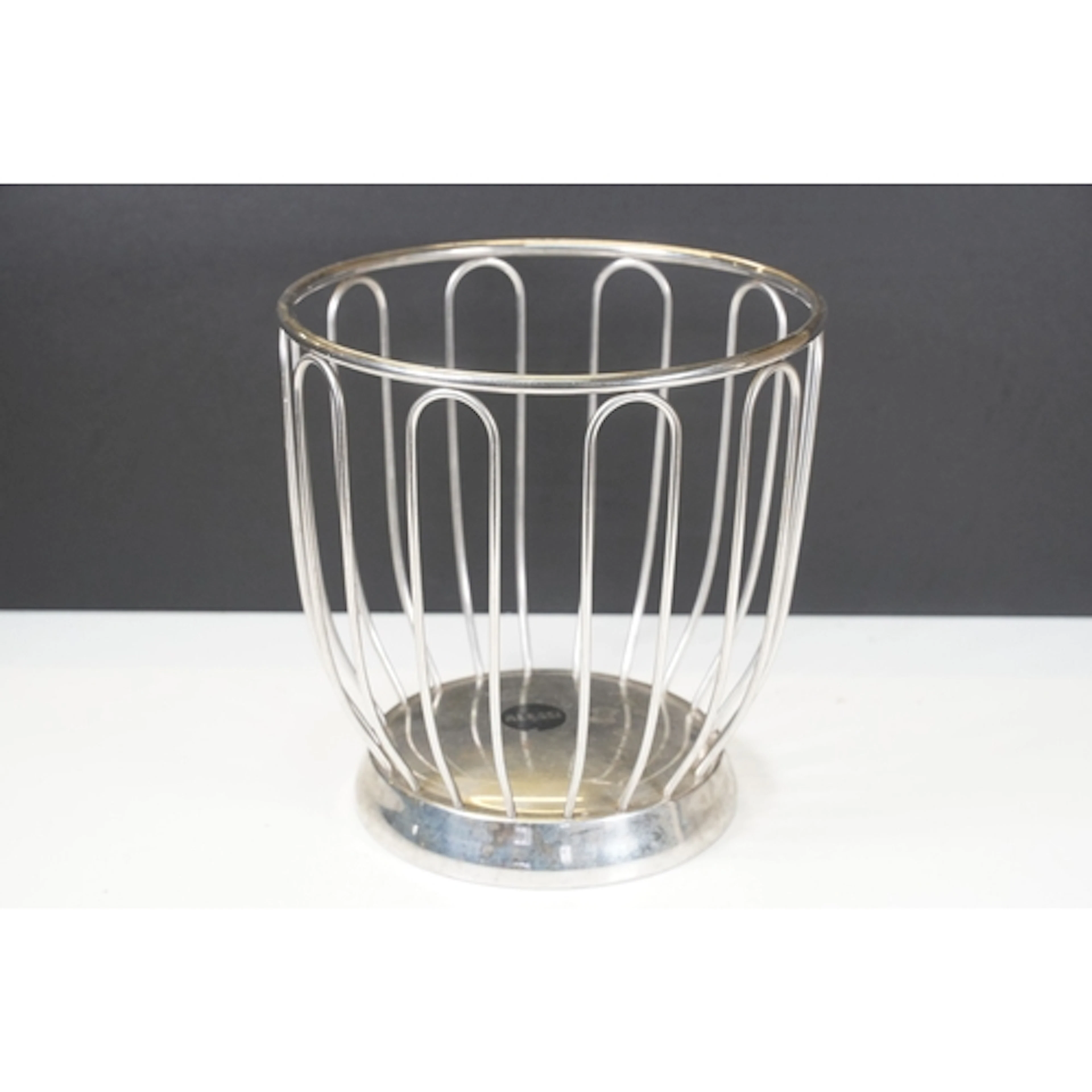 Alessi stainless steel basket having 'Alessi' logo to bottom...