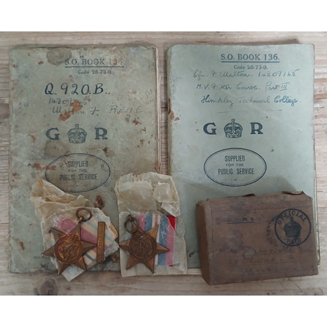 A pair of WWII stars and two S.O. Books inscribed '14309743 ...