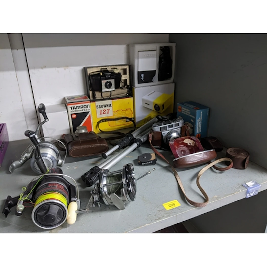 A mixed lot of film cameras and accessories, along with vari...