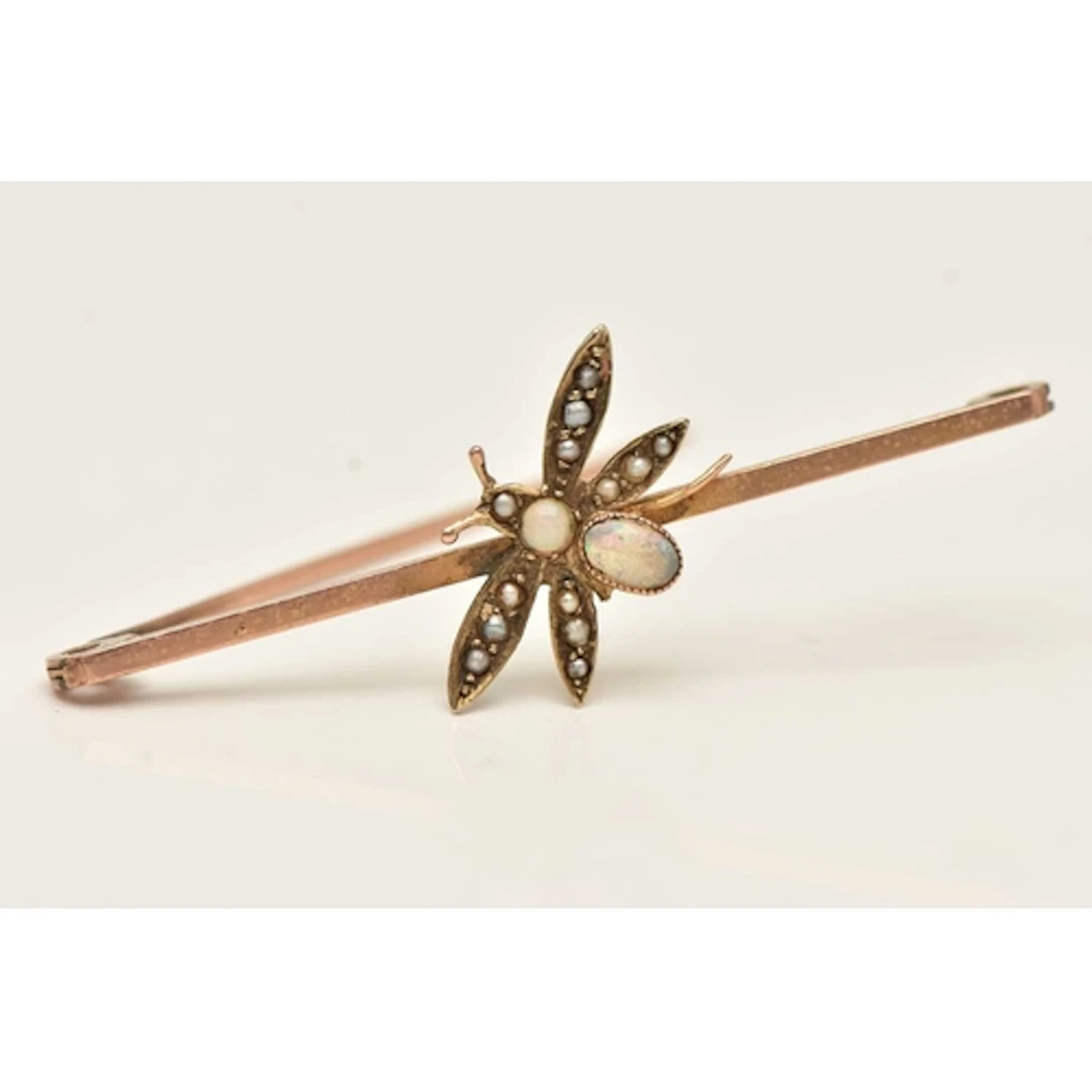 A ROSE METAL BUG BAR BROOCH, opal and split pearl set bug, o...