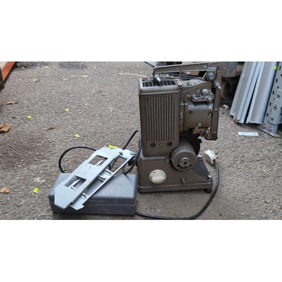 Specto cine projector with a cast-metal housing, folding ree...