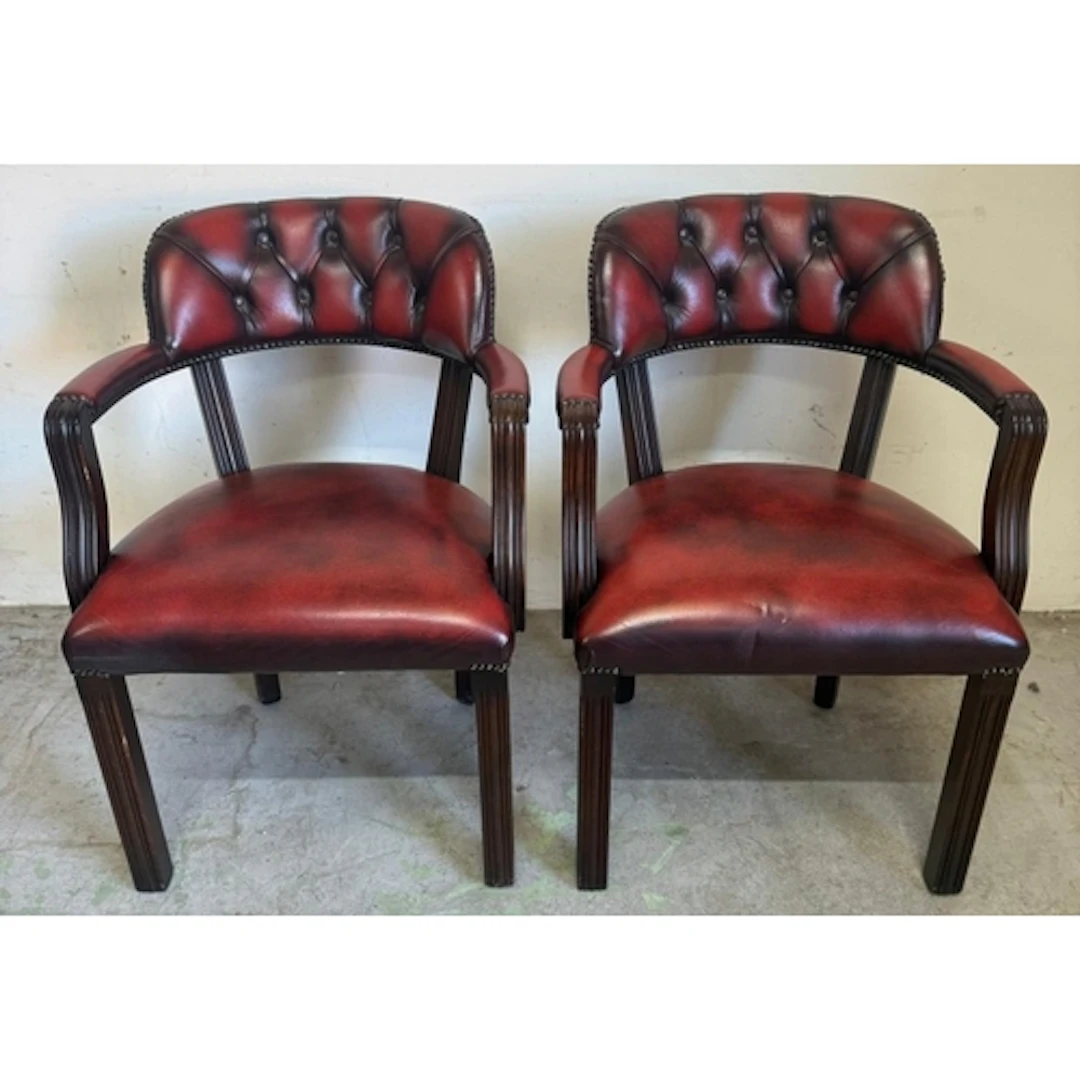A pair of red faux leather chesterfield style court captains...