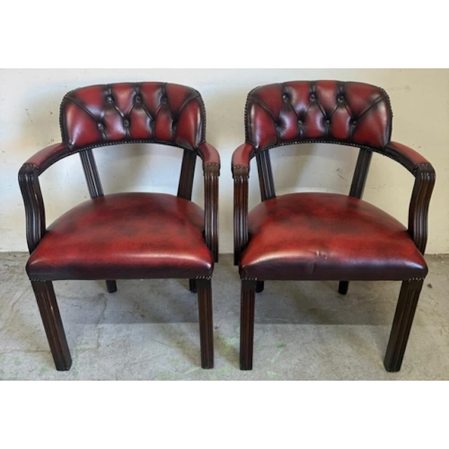 A pair of red faux leather chesterfield style court captains...