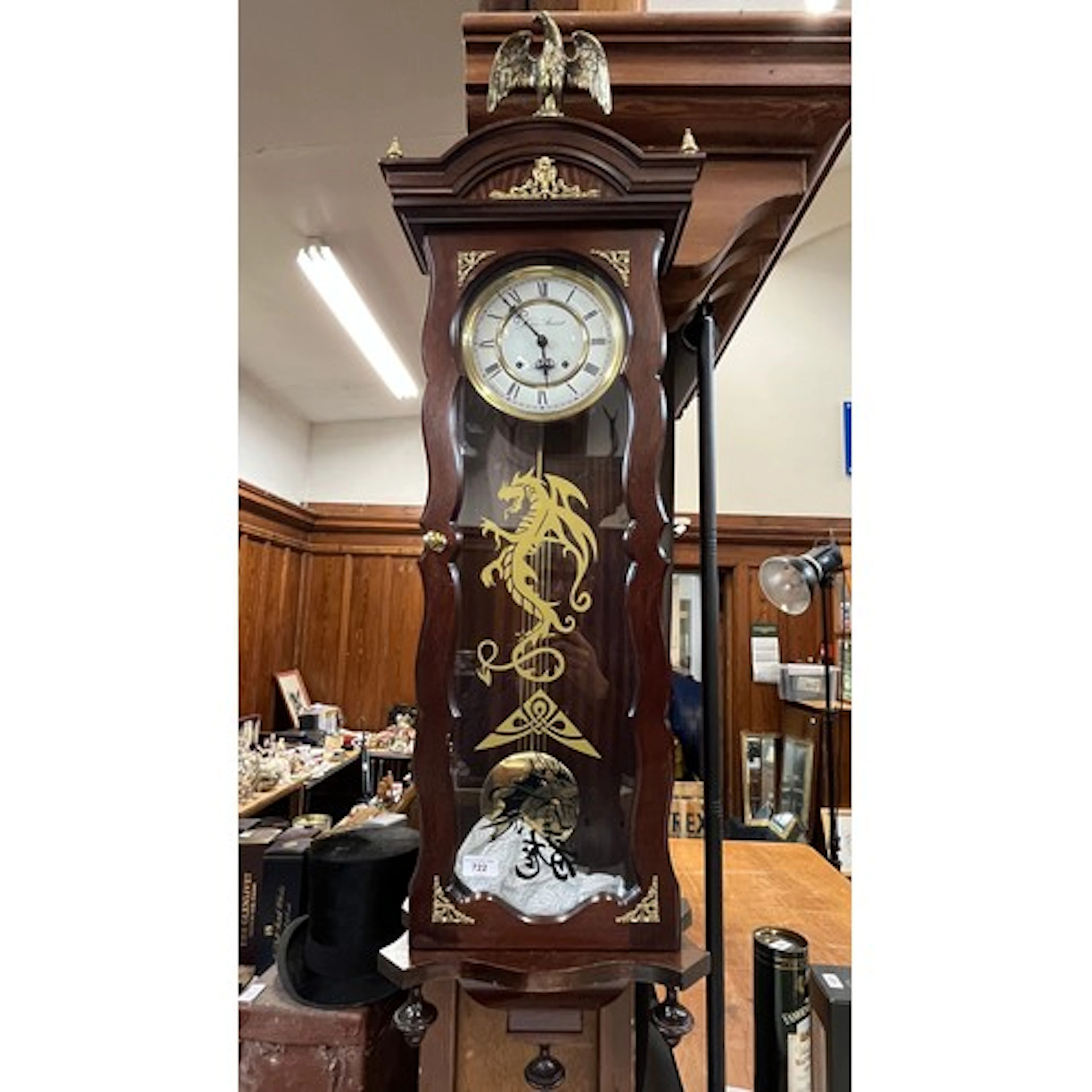James Stewart wall clock with eagle surmount.