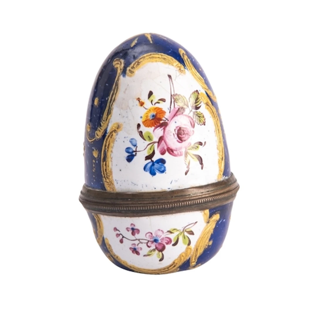 A George III Bilston enamelled nutmeg grater in the form of ...