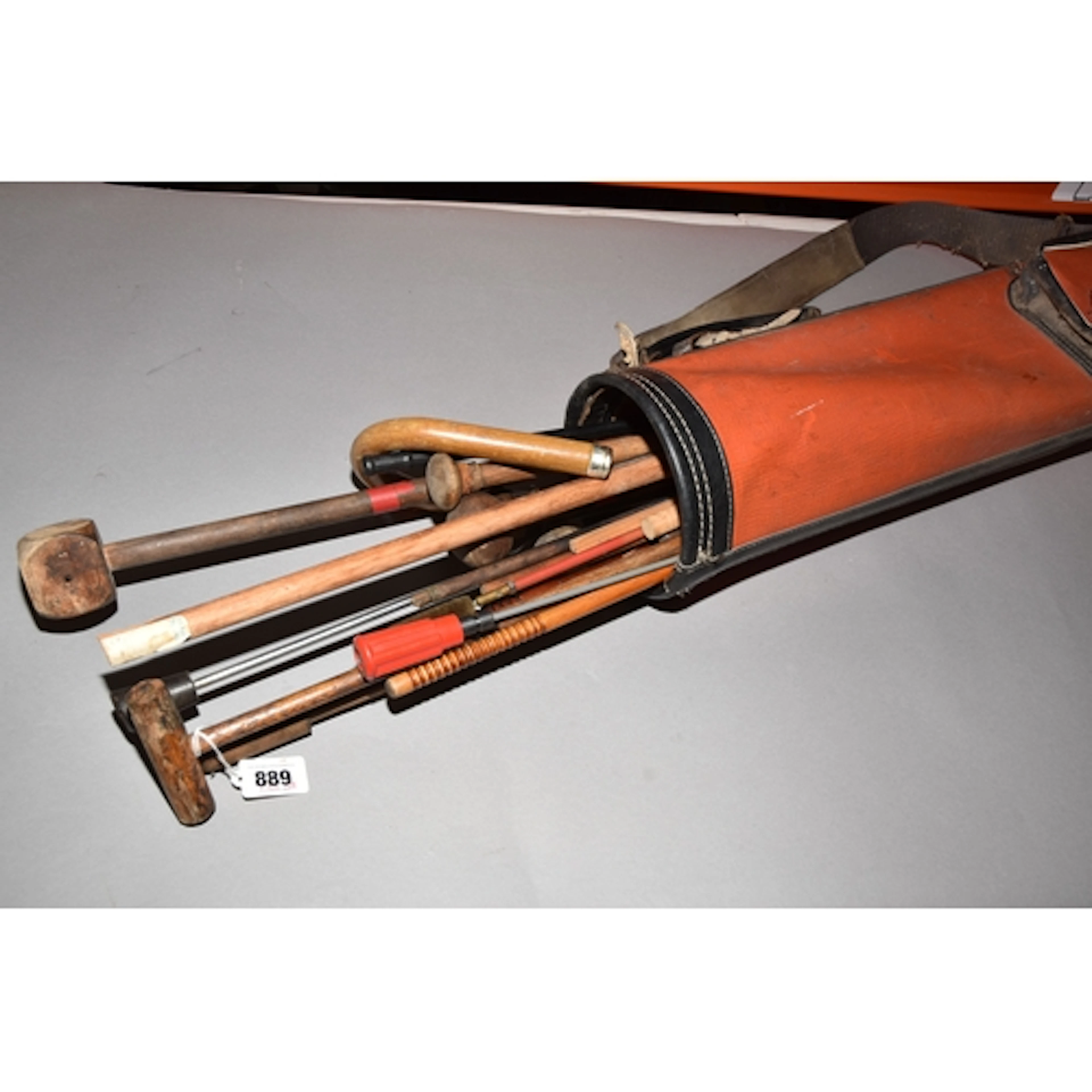 A GOLF BAG CONTAINING AN ASSORTMENT OF WOODEN AND METAL GUN ...