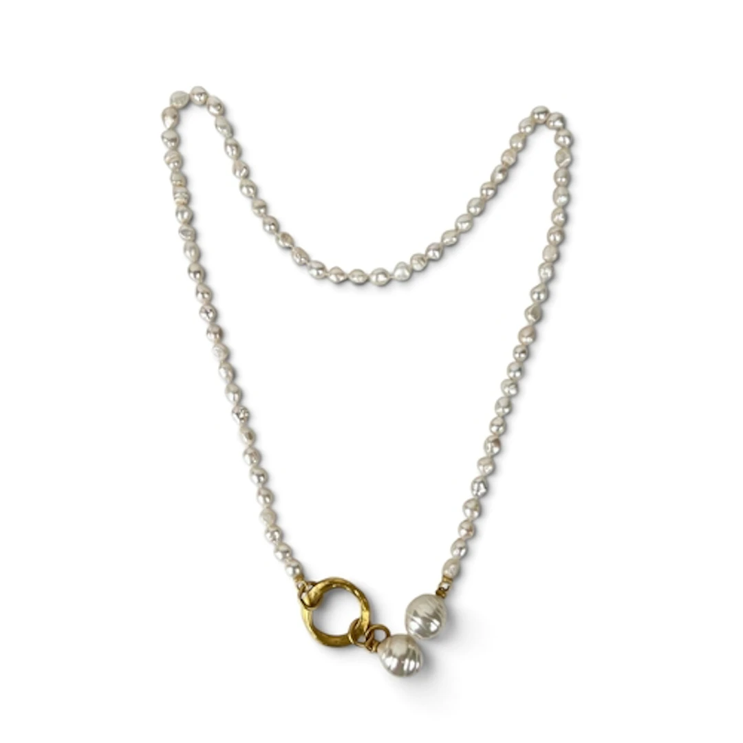 A LONG BAROQUE PEARL NECKLACE WITH GILT METAL RINGED CLASP A...