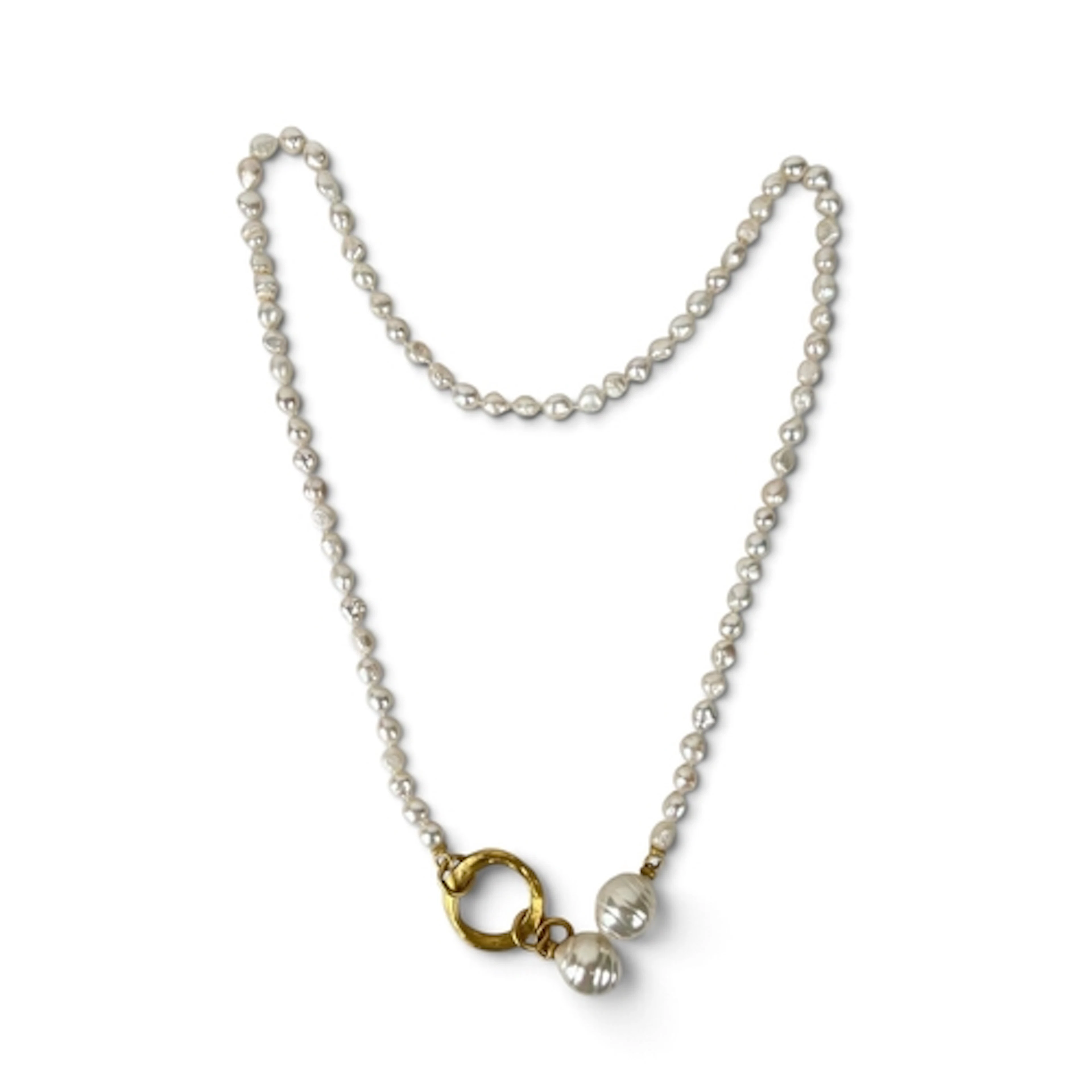 A LONG BAROQUE PEARL NECKLACE WITH GILT METAL RINGED CLASP A...